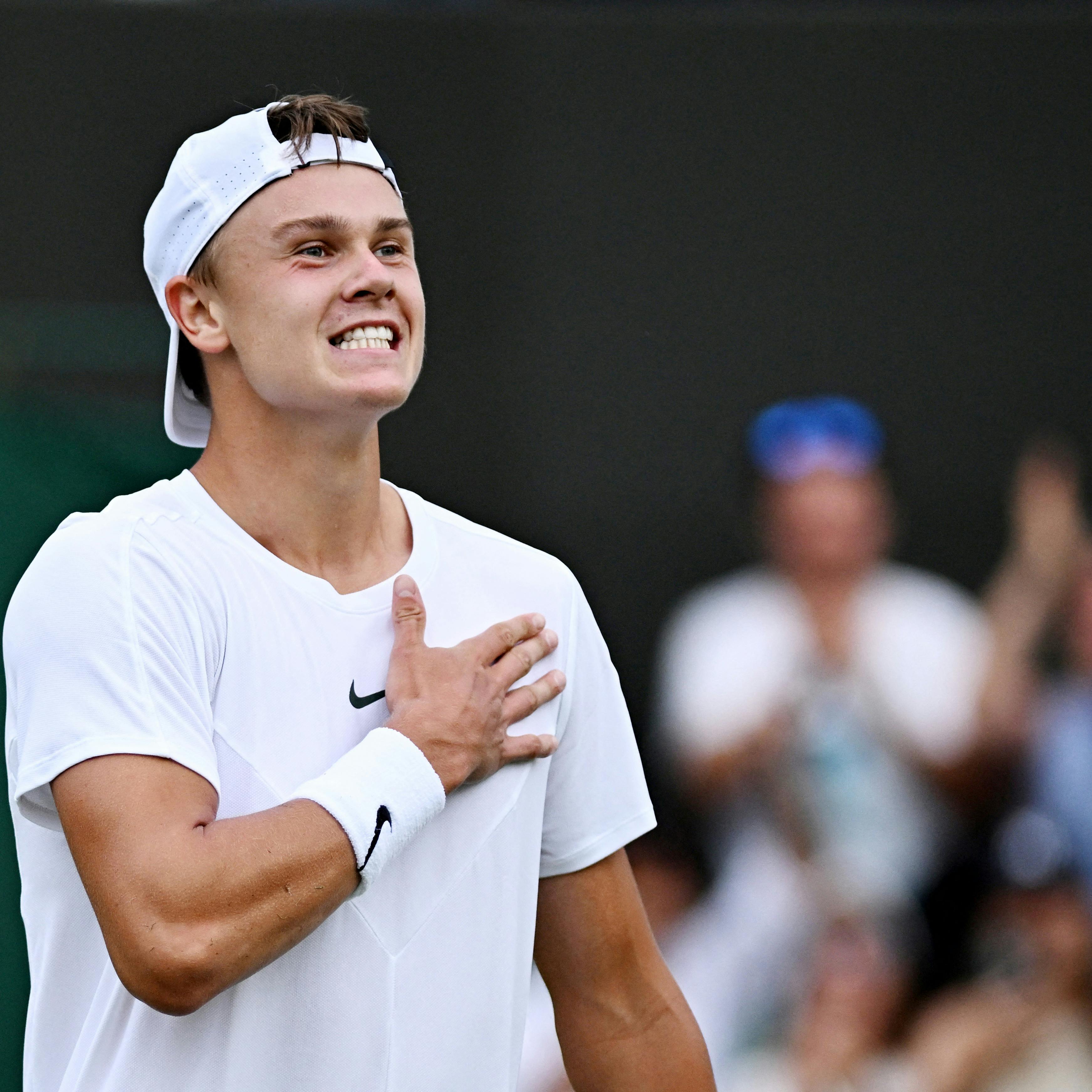 Tennis - Wimbledon - All England Lawn Tennis and Croquet Club, London, Britain - July 8, 2023 Denmark's Holger Rune celebrates after winning his third round match against Spain's Alejandro Davidovich Fokina REUTERS/Dylan Martinez