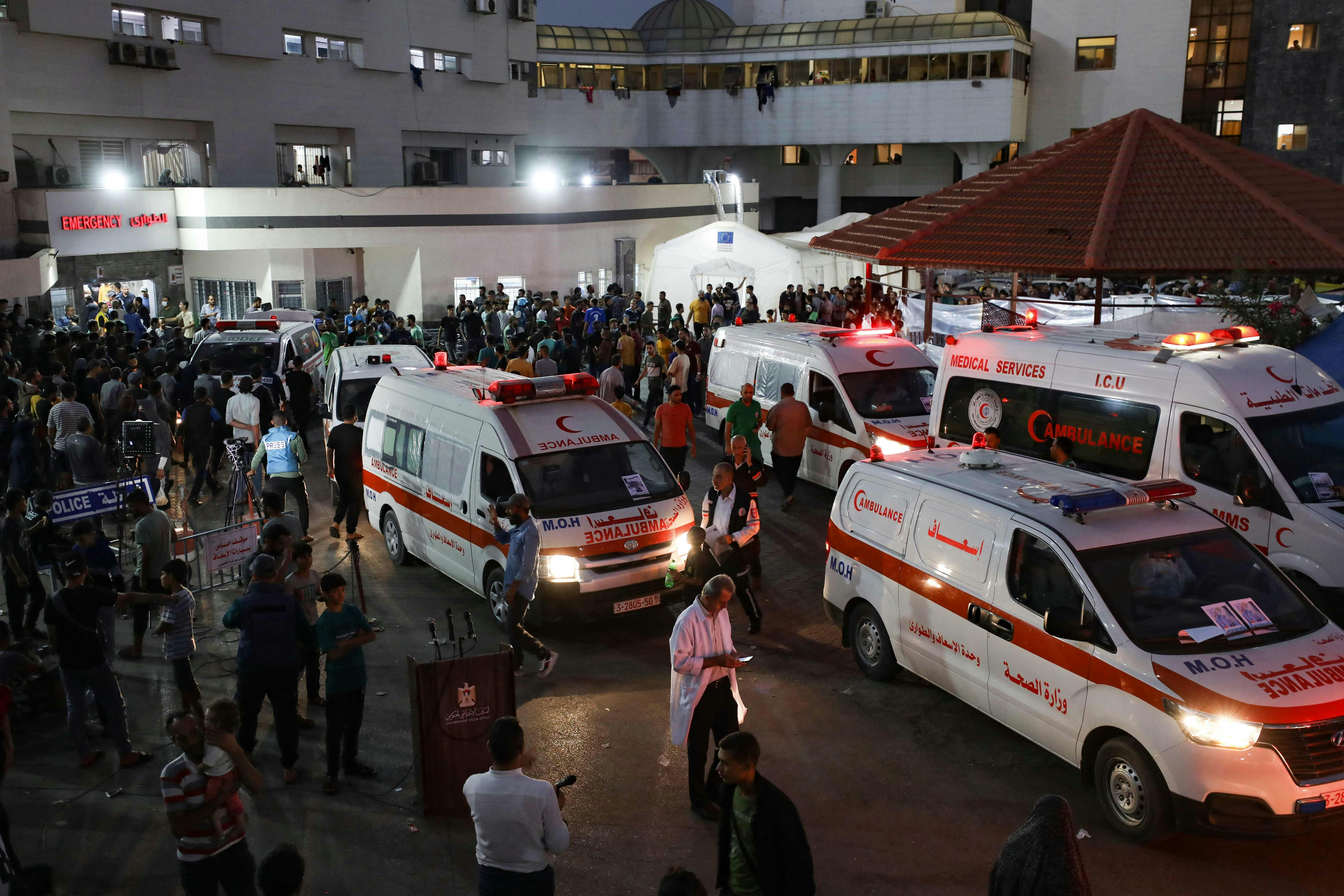 Ambulances carrying victims of Israeli strikes crowd the entrance to the emergency ward of the Al-Shifa hospital in Gaza City on October 15, 2023. Israel embarked on a withering air campaign against Hamas militants in Gaza after they carried out a brutal attack on Israel on October 7 that left more than 1, 400 people killed in Israel. (Photo by Dawood NEMER / AFP)