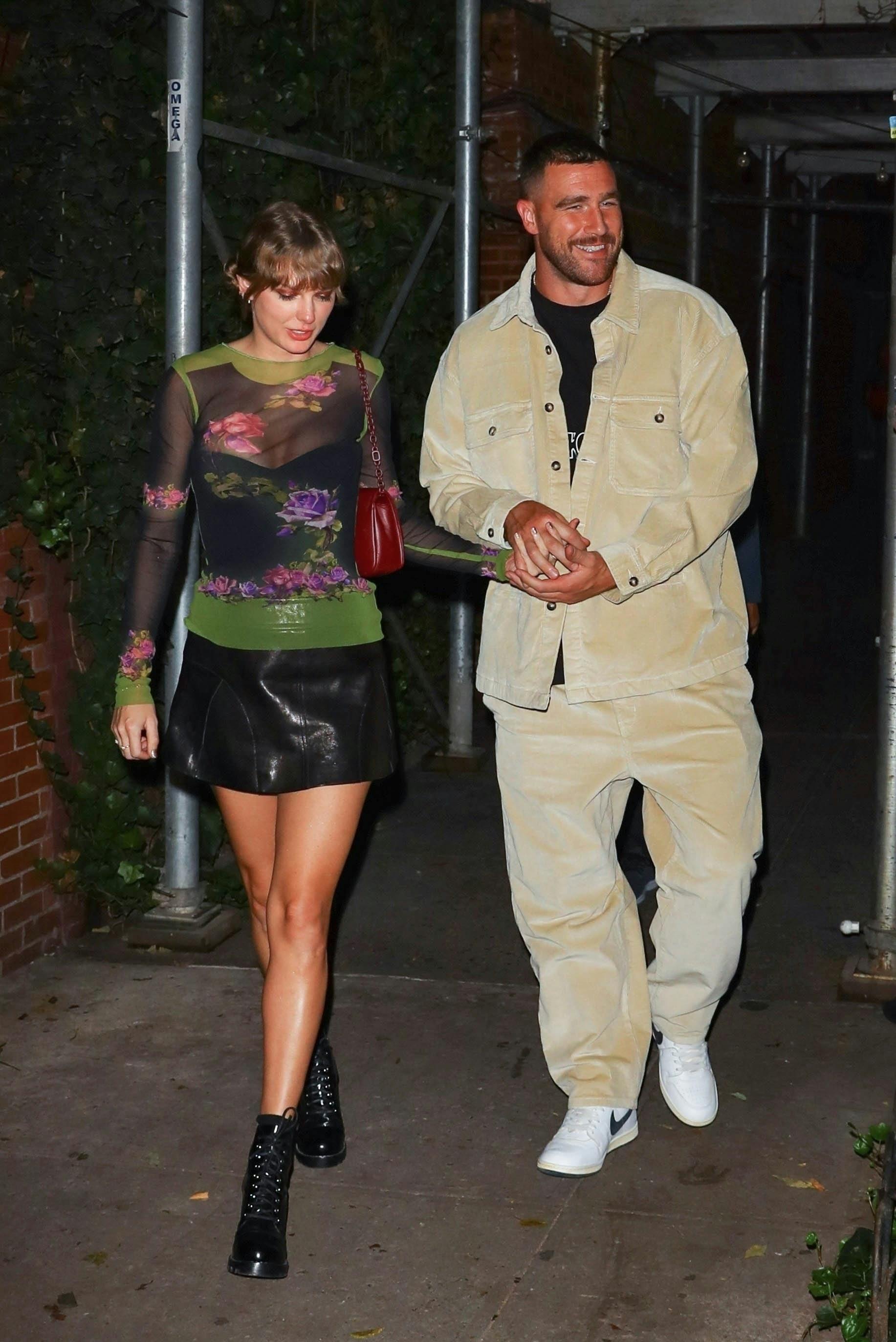 New York, NY - Lovebirds Taylor Swift and Travis Kelce are all smiles while exiting The Waverly Inn in New York City. The hot new couple attracted the attention of a small group of 'Swifties' who were so very excited to catch a glimpse of their favorite pop star! Pictured: Taylor Swift, Travis Kelce BACKGRID USA 15 OCTOBER 2023 USA: +1 310 798 9111 / usasales@backgrid.com UK: +44 208 344 2007 / uksales@backgrid.com *UK Clients - Pictures Containing Children Please Pixelate Face Prior To Publication*