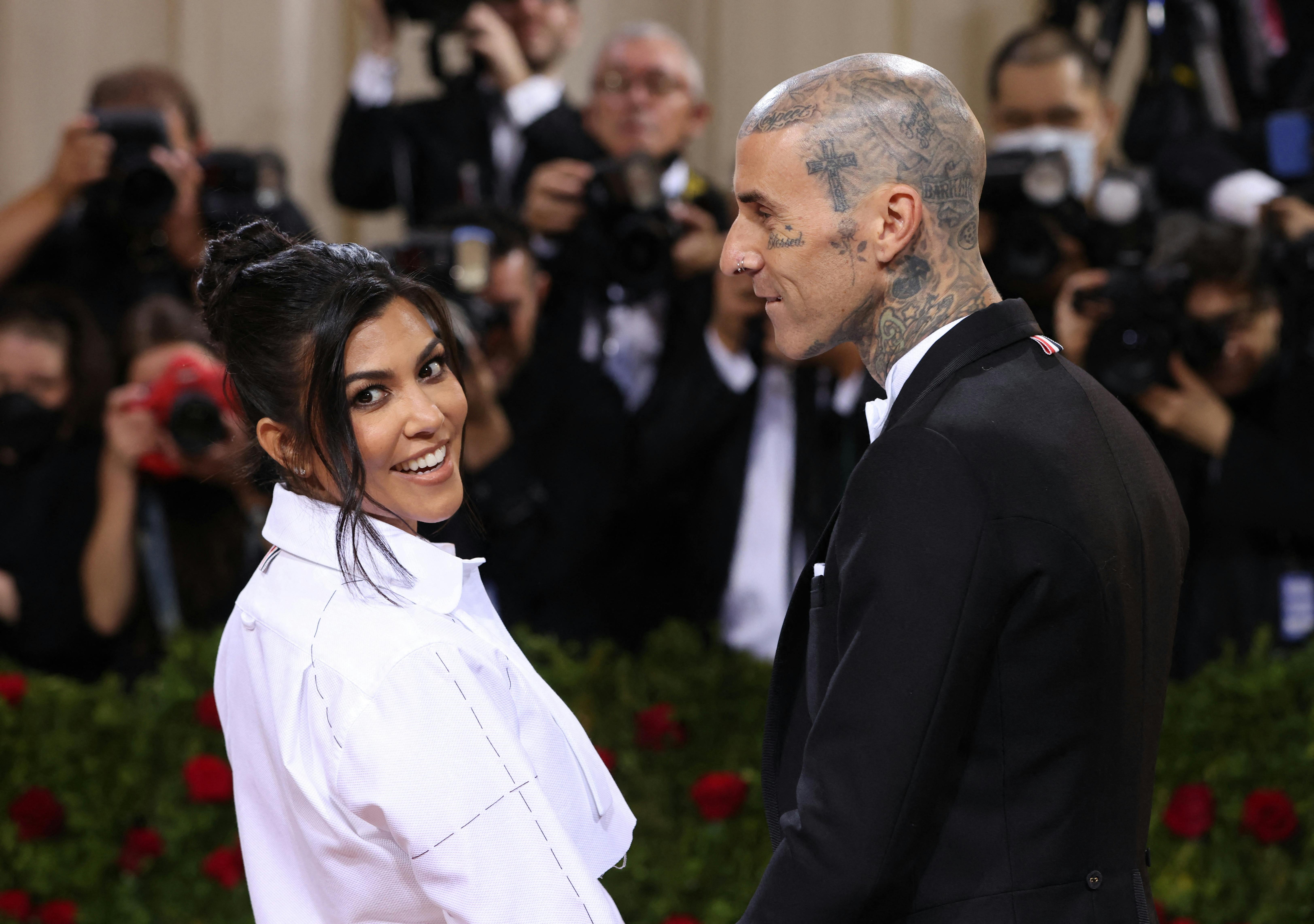 Travis Barker and Kourtney Kardashian arrive at the In America: An Anthology of Fashion themed Met Gala at the Metropolitan Museum of Art in New York City, New York, U.S., May 2, 2022. REUTERS/Andrew Kelly