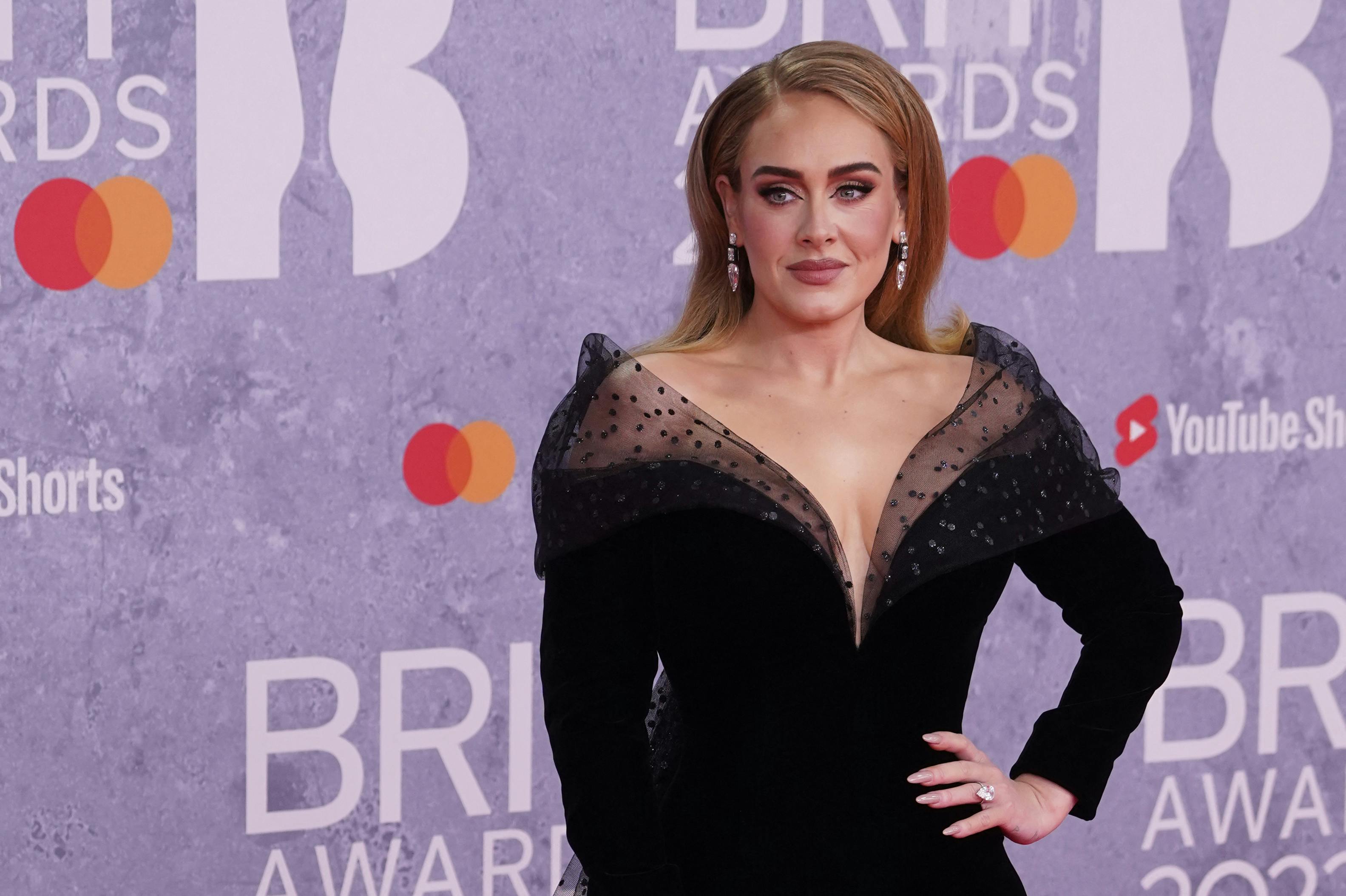 British singer Adele Laurie Blue Adkins aka Adele poses on the red carpet upon her arrival for the BRIT Awards 2022 in London on February 8, 2022. Niklas HALLE'N / AFP