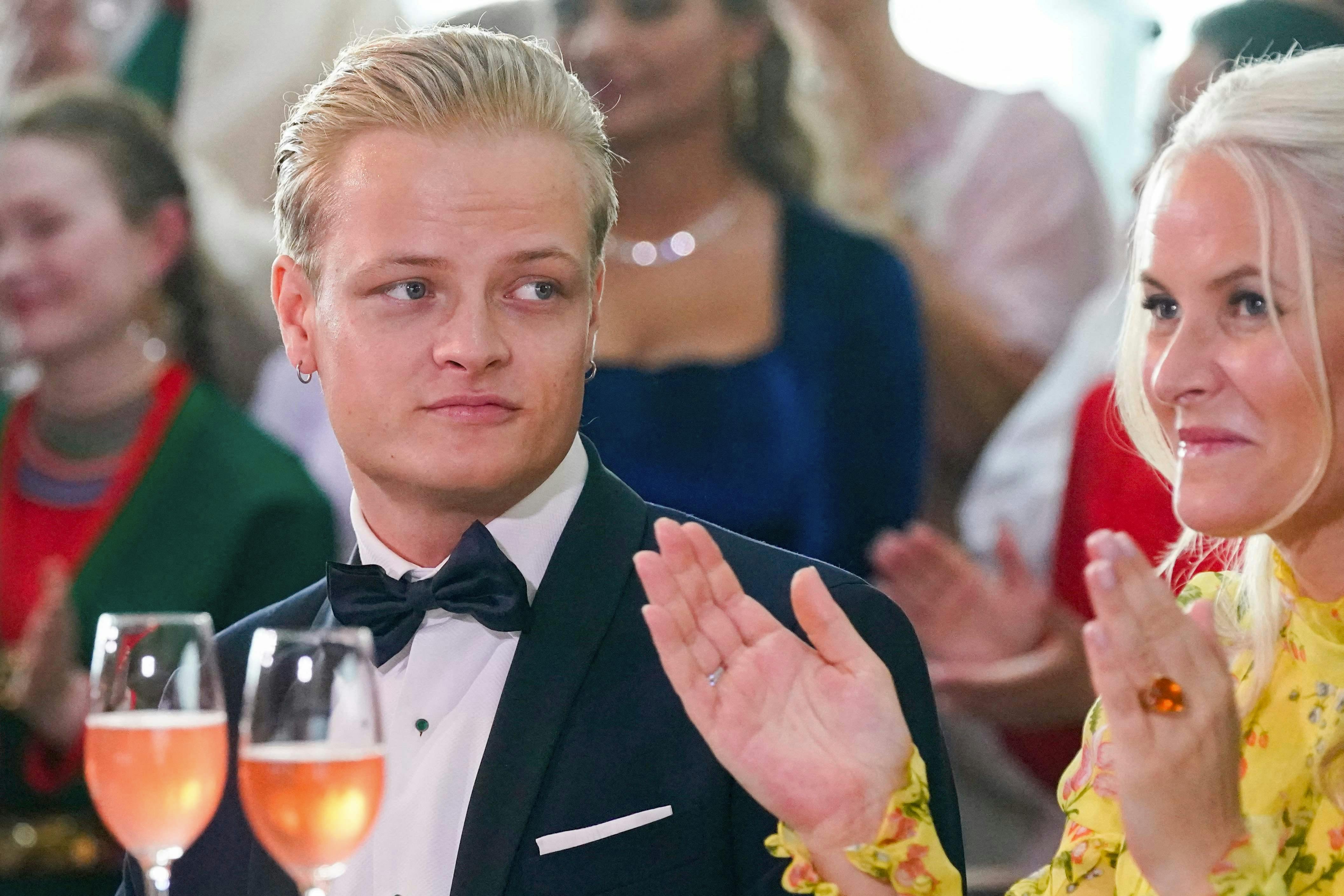 Picture taken on June 16, 2022 in Oslo, Norway, shows Marius Borg Høiby sitting next to his mother Norwegian Crown Princess Mette-Marit. The 27-year-old son of Norwegian Crown Princess Mette-Marit was arrested at the weekend on suspicion of assaulting a woman, police said on August 7, 2024. Mette-Marit's son Marius Borg Hoiby was born in 1997 from a relationship prior to her 2001 marriage to Norway's future king Crown Prince Haakon. (Photo by Lise Åserud / NTB / AFP) / Norway OUT