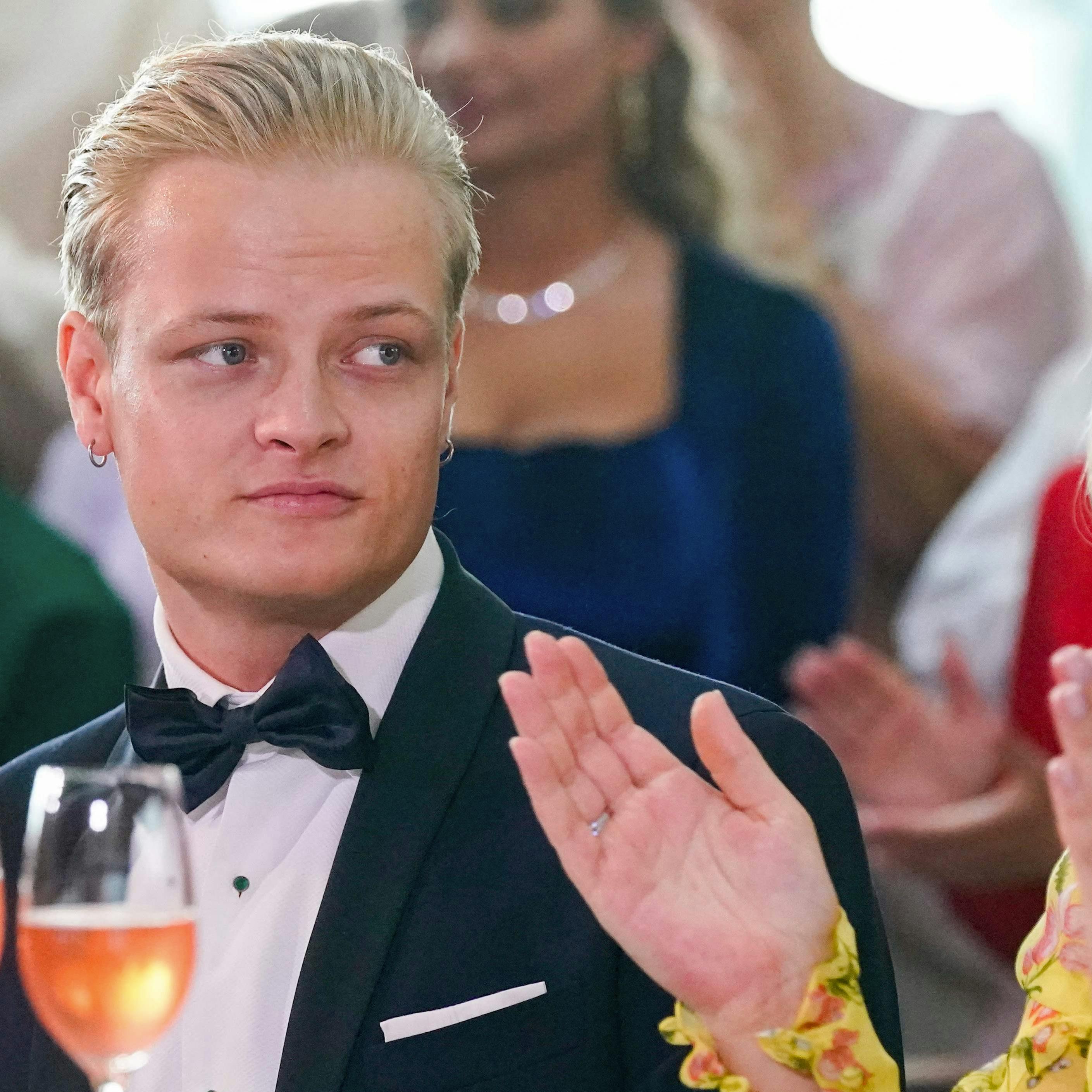 Picture taken on June 16, 2022 in Oslo, Norway, shows Marius Borg Høiby sitting next to his mother Norwegian Crown Princess Mette-Marit. The 27-year-old son of Norwegian Crown Princess Mette-Marit was arrested at the weekend on suspicion of assaulting a woman, police said on August 7, 2024. Mette-Marit's son Marius Borg Hoiby was born in 1997 from a relationship prior to her 2001 marriage to Norway's future king Crown Prince Haakon. (Photo by Lise Åserud / NTB / AFP) / Norway OUT