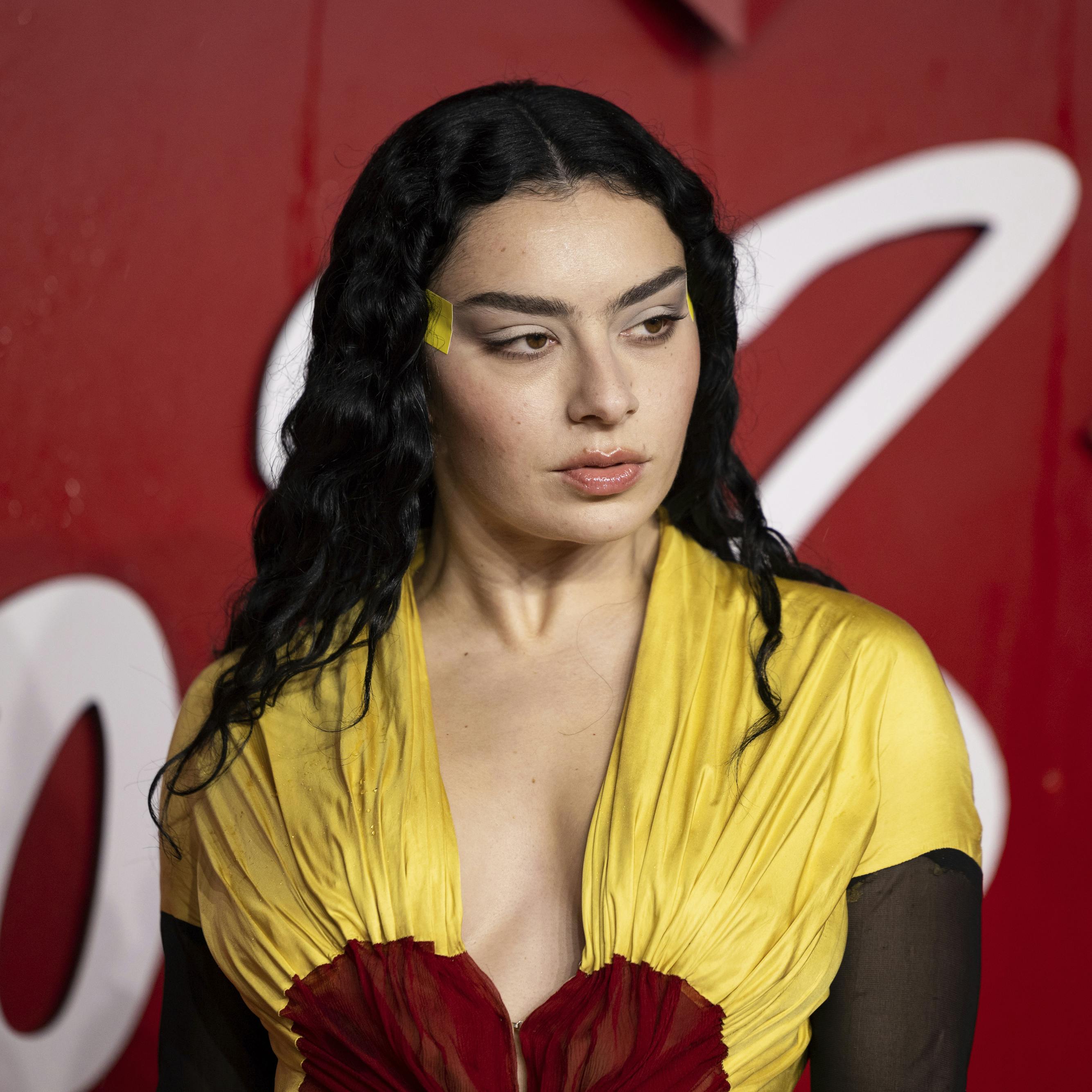 Charli XCX poses for photographers upon arrival at the British Fashion Awards on Monday, Dec. 4, 2023 in London. (Vianney Le Caer/Invision/AP)