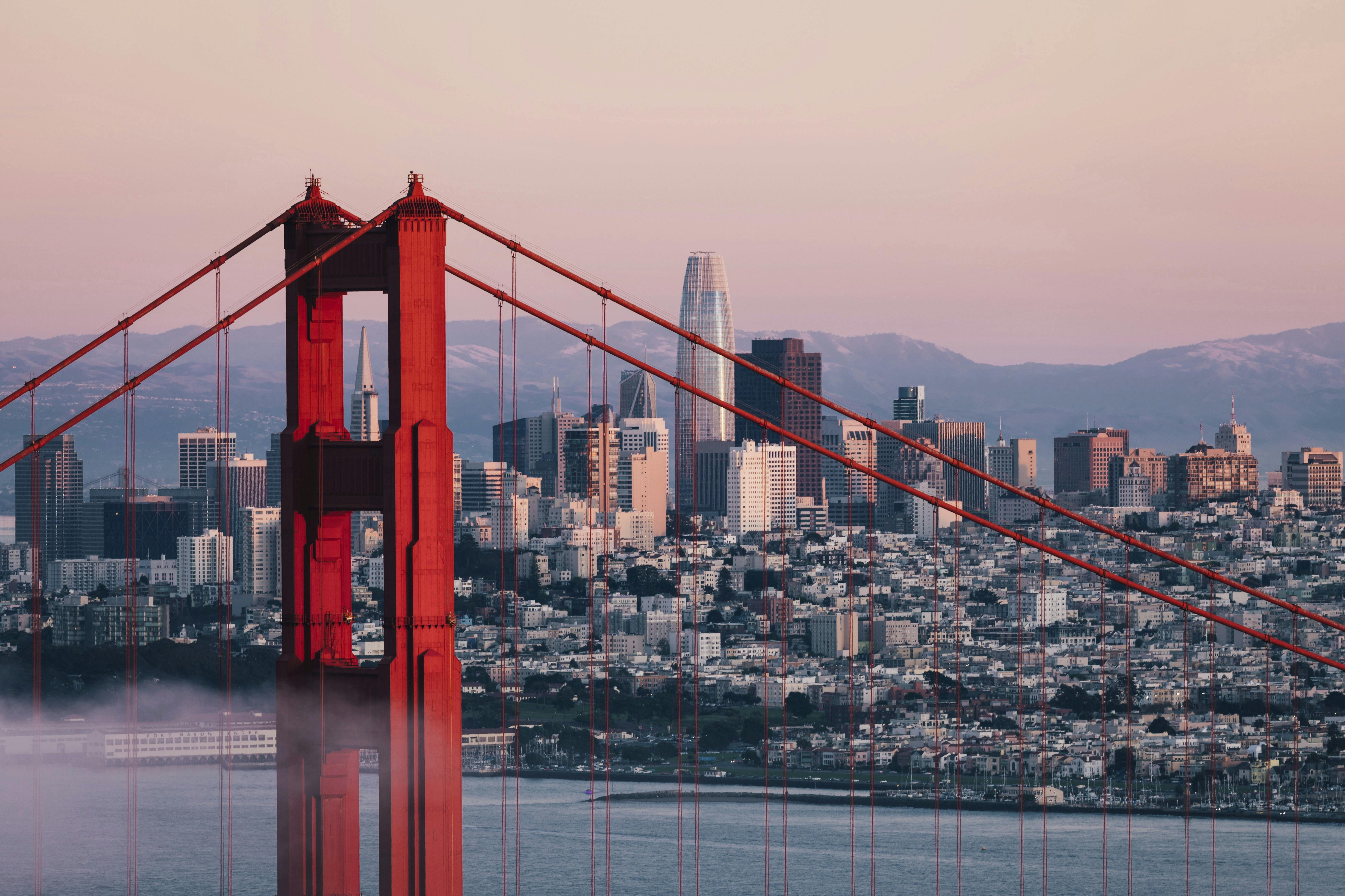 Golden Gate Bridge tower with San Francisco's skyline in background. Anne Christine Persson