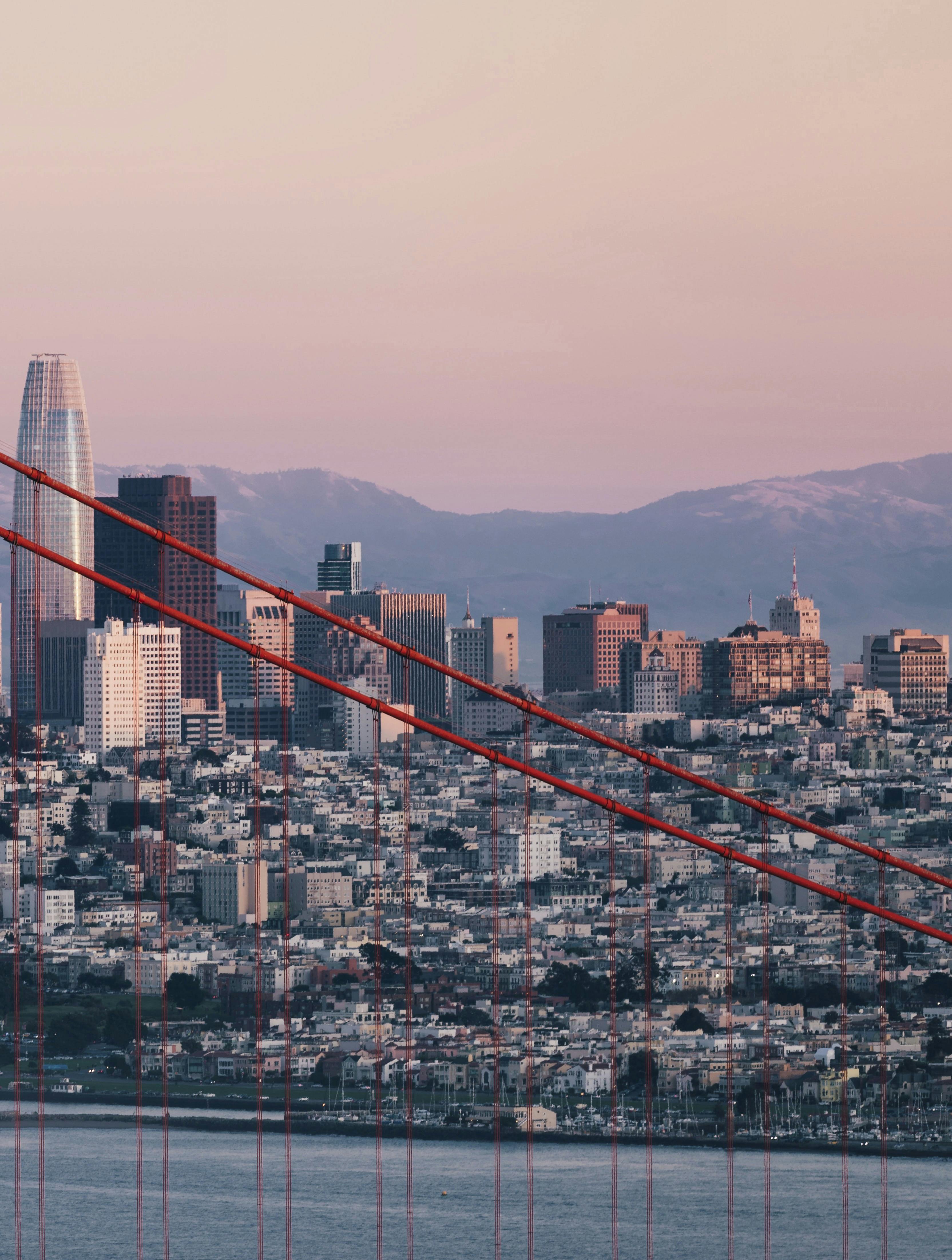 Golden Gate Bridge tower with San Francisco's skyline in background. Anne Christine Persson