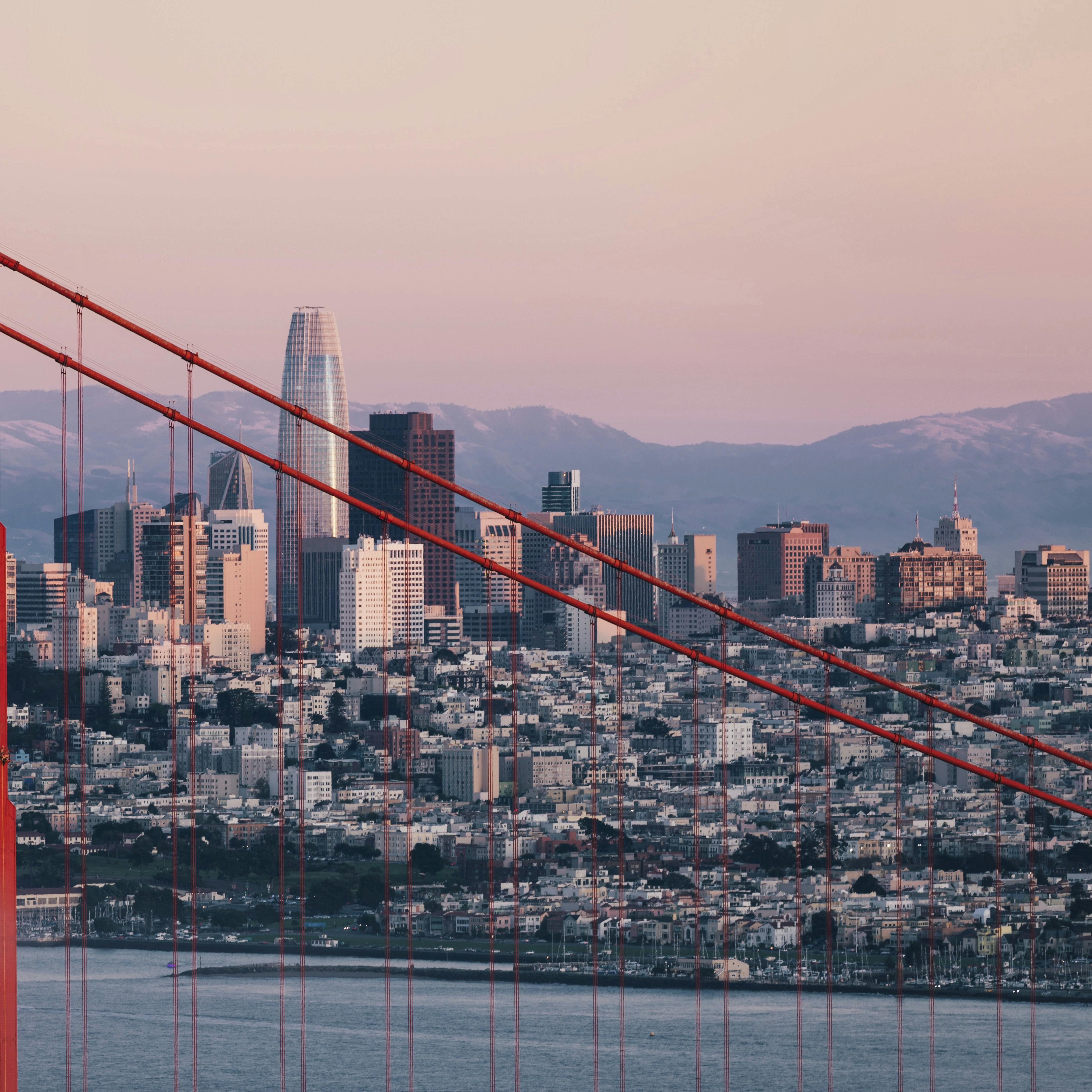 Golden Gate Bridge tower with San Francisco's skyline in background. Anne Christine Persson