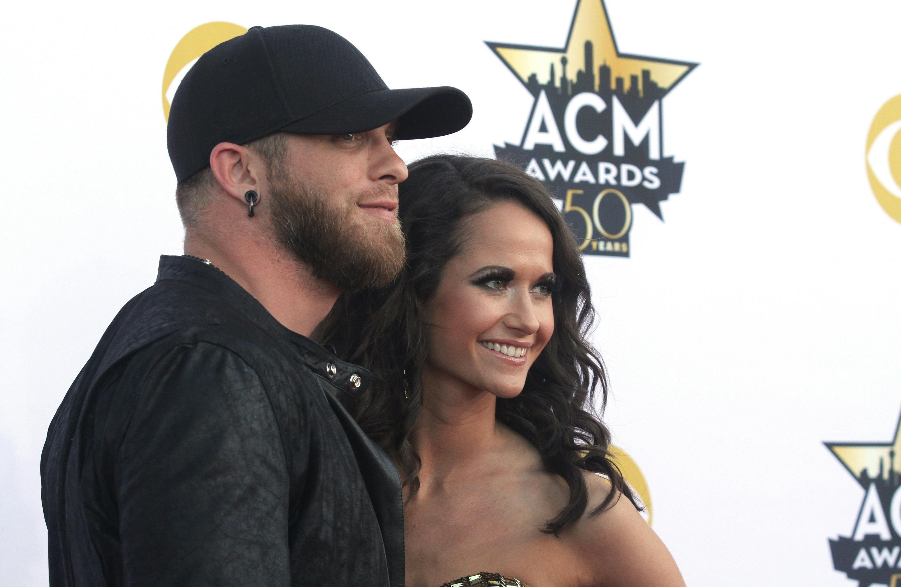 Brantley Gilbert, left, and Amber Cochran arrive at the 50th annual Academy of Country Music Awards at AT&T Stadium on Sunday, April 19, 2015, in Arlington, Texas. (Photo by Jack Plunkett/Invision/AP)