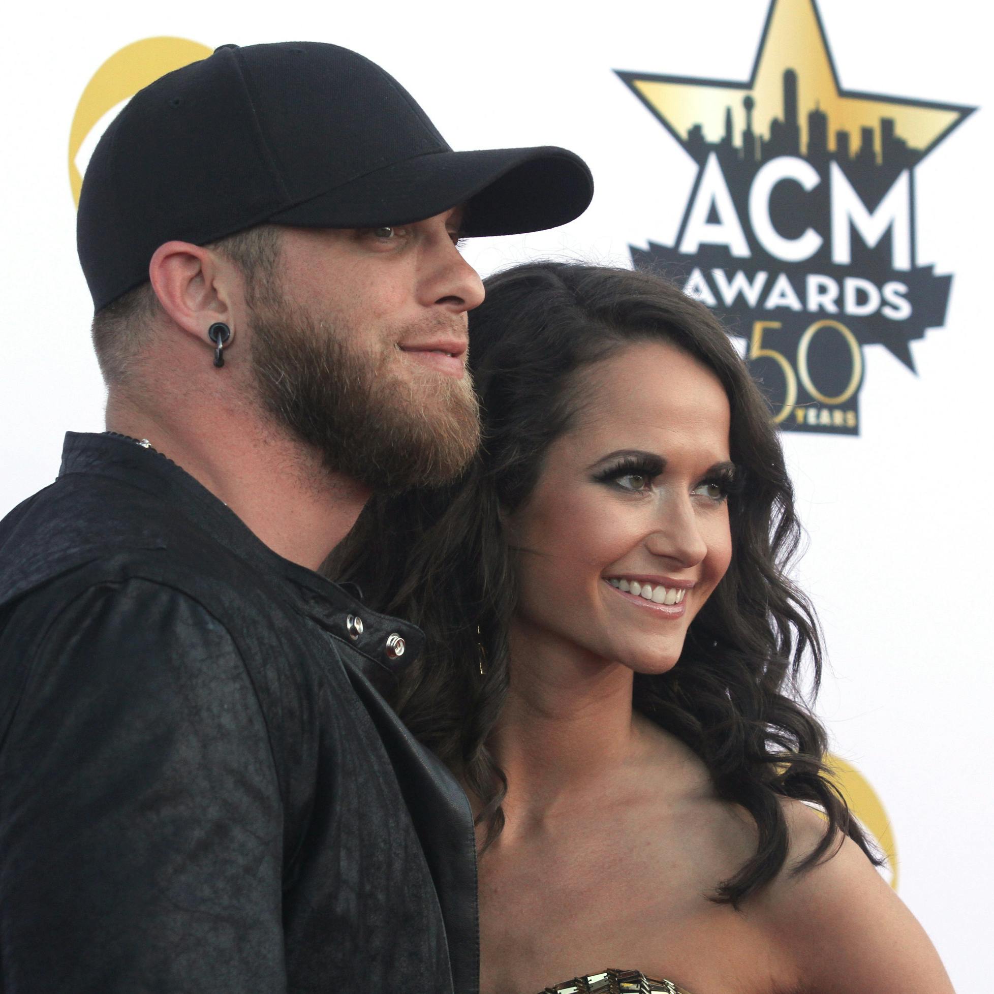 Brantley Gilbert, left, and Amber Cochran arrive at the 50th annual Academy of Country Music Awards at AT&T Stadium on Sunday, April 19, 2015, in Arlington, Texas. (Photo by Jack Plunkett/Invision/AP)