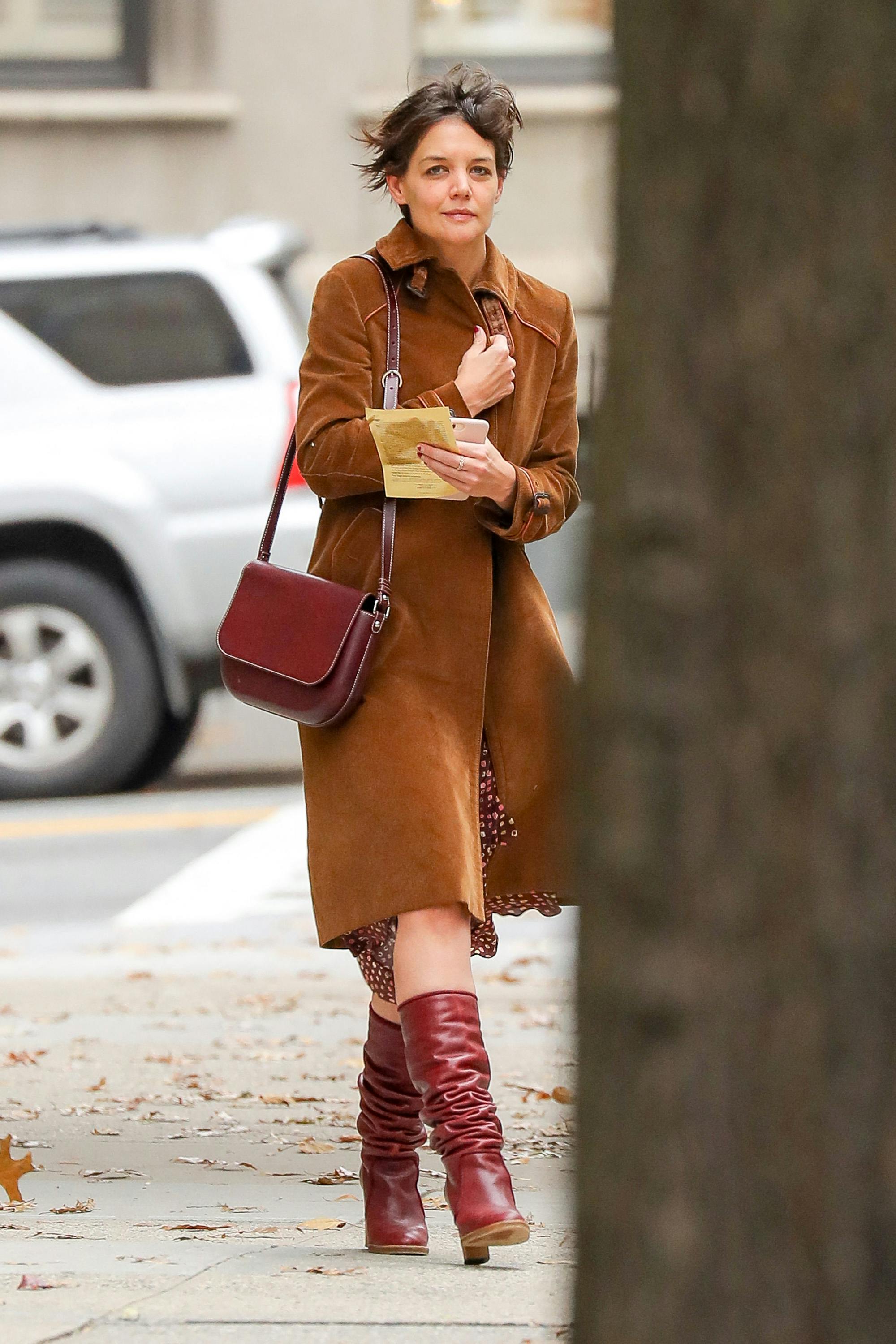 EXCLUSIVE: Katie Holmes steps out wearing a suede trench coat with burgundy boots and matching bag in New York City. 06 Dec 2017 Pictured: Katie Holmes. Photo credit: ZapatA/MEGA TheMegaAgency.com +1 888 505 6342 (Mega Agency TagID: MEGA129090_005.jpg) [Photo via Mega Agency]