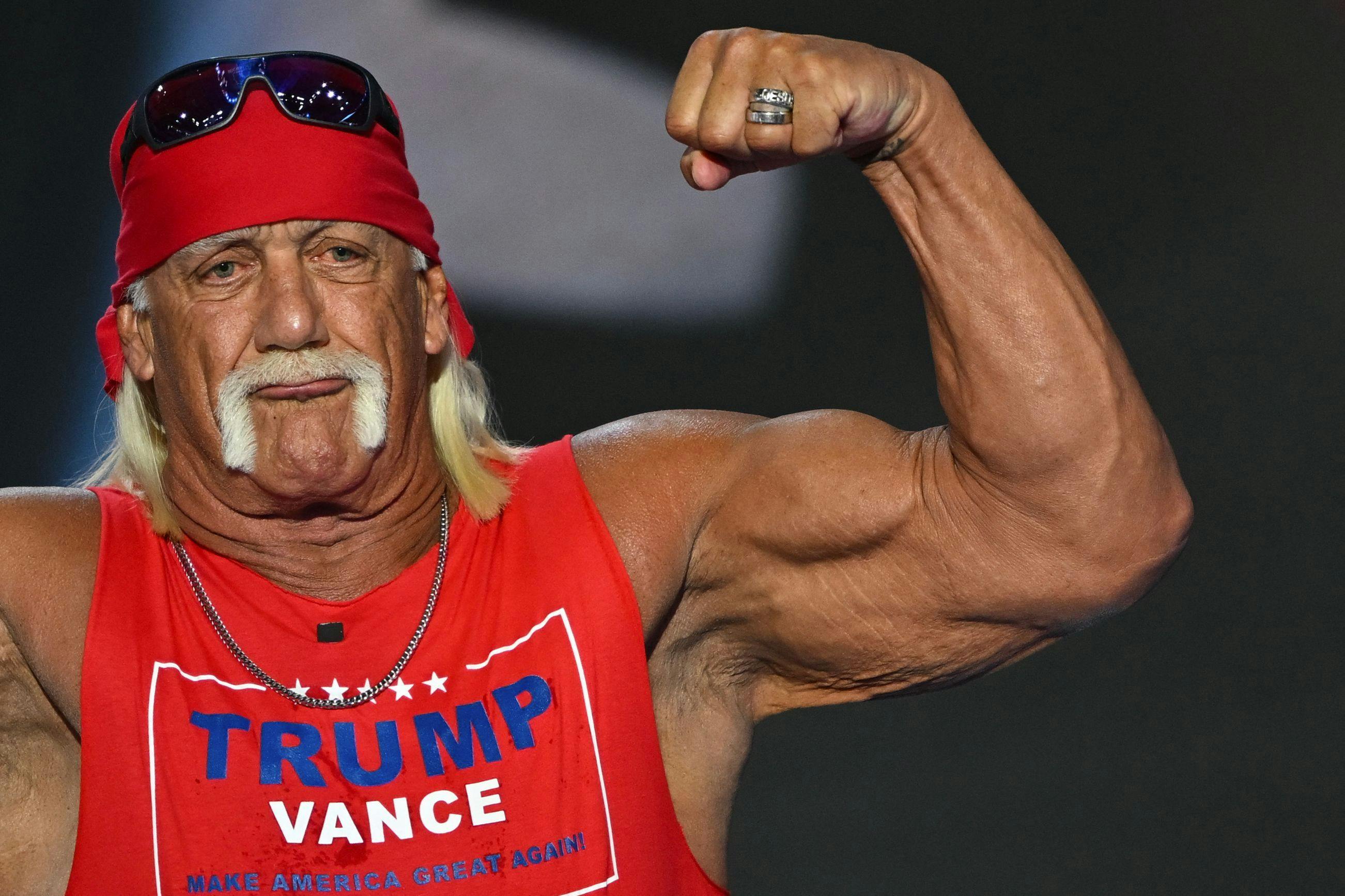 US pro-wrestler Hulk Hogan flexes his muscles after speaking during the last day of the 2024 Republican National Convention at the Fiserv Forum in Milwaukee, Wisconsin, on July 18, 2024. Donald Trump will get a hero's welcome Thursday as he accepts the Republican Party's nomination to run for US president in a speech capping a convention dominated by the recent attempt on his life. (Photo by ANDREW CABALLERO-REYNOLDS / AFP)