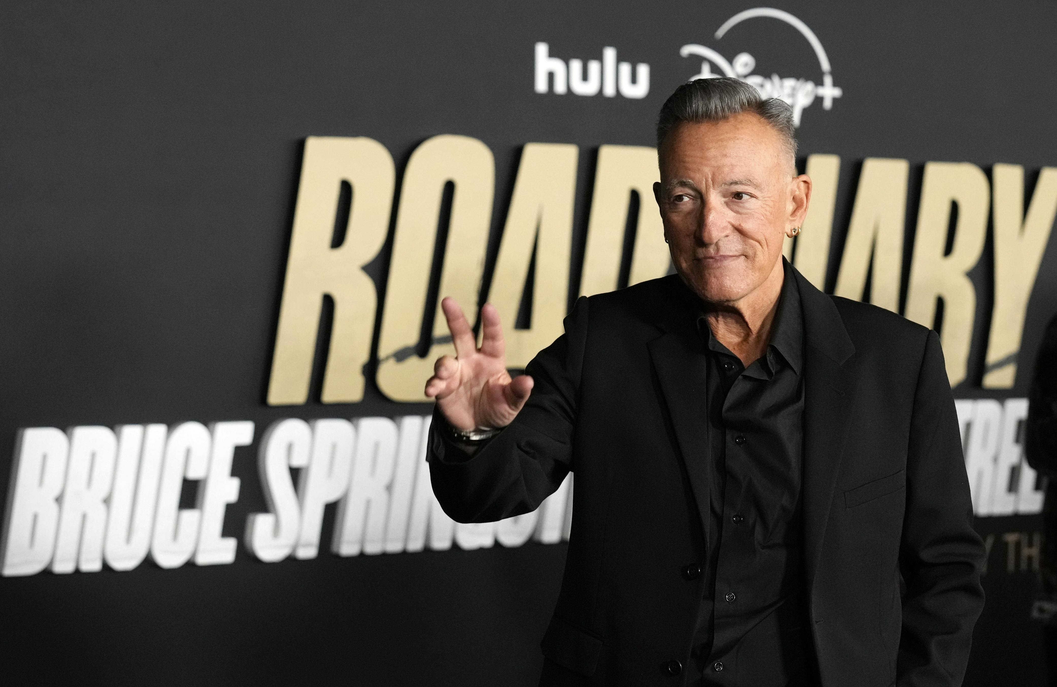 Bruce Springsteen waves at the premiere of the documentary film "Road Diary: Bruce Springsteen and the E Street Band, " Monday, Oct. 21, 2024, at The Academy Museum of Motion Pictures in Los Angeles. (AP Photo/Chris Pizzello)