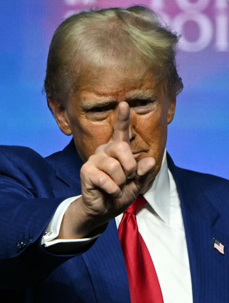 TOPSHOT - Former US President and Republican presidential candidate Donald Trump gestures onstage after speaking during a Turning Point Action 'United for Change' campaign rally in Las Vegas, Nevada on October 24, 2024. (Photo by Patrick T. Fallon / AFP)