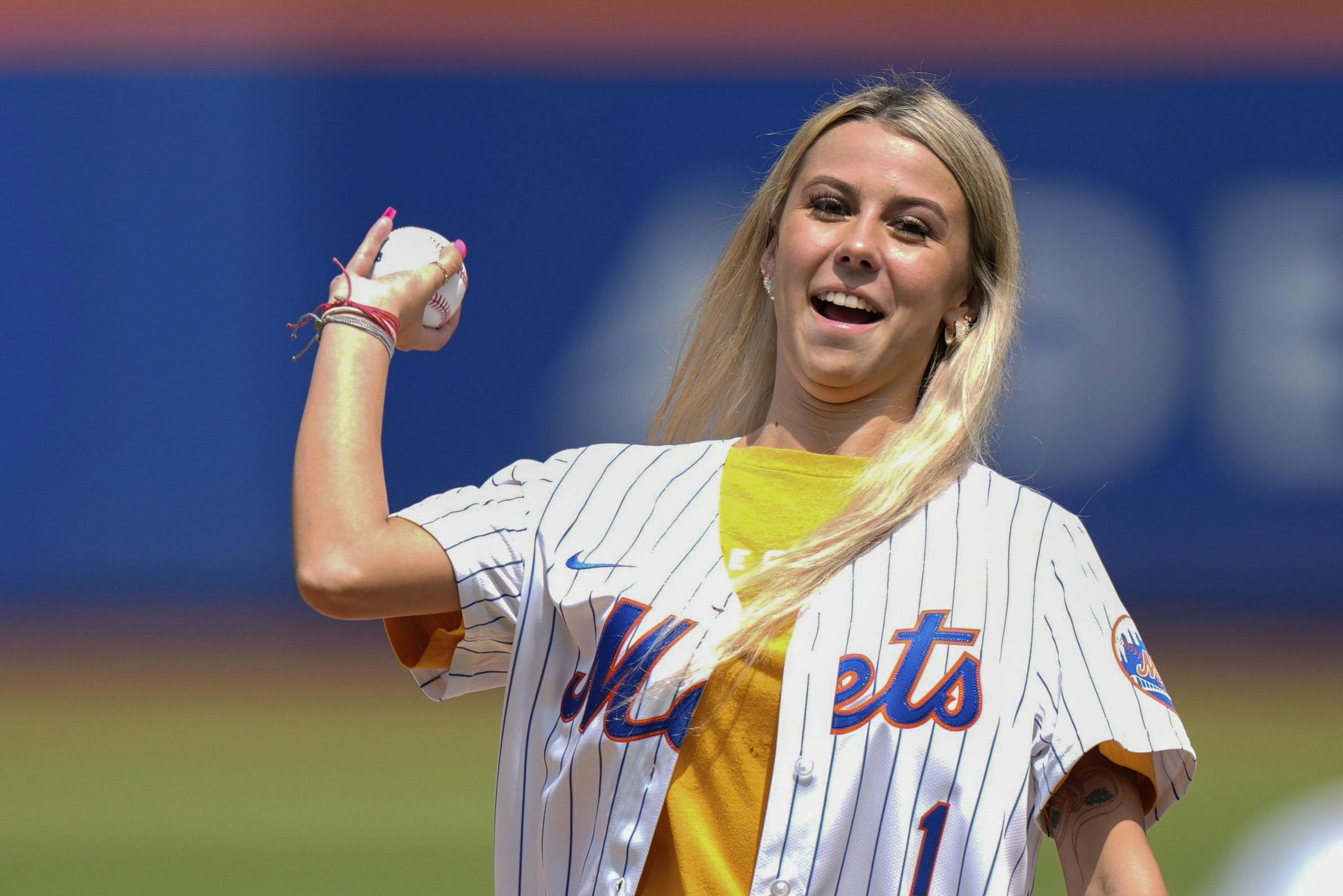 Hailey Welch throws out a ceremonial first pitch before a baseball game between the New York Mets and the Oakland Athletics, Thursday, Aug. 15, 2024, in New York. (AP Photo/Frank Franklin II)