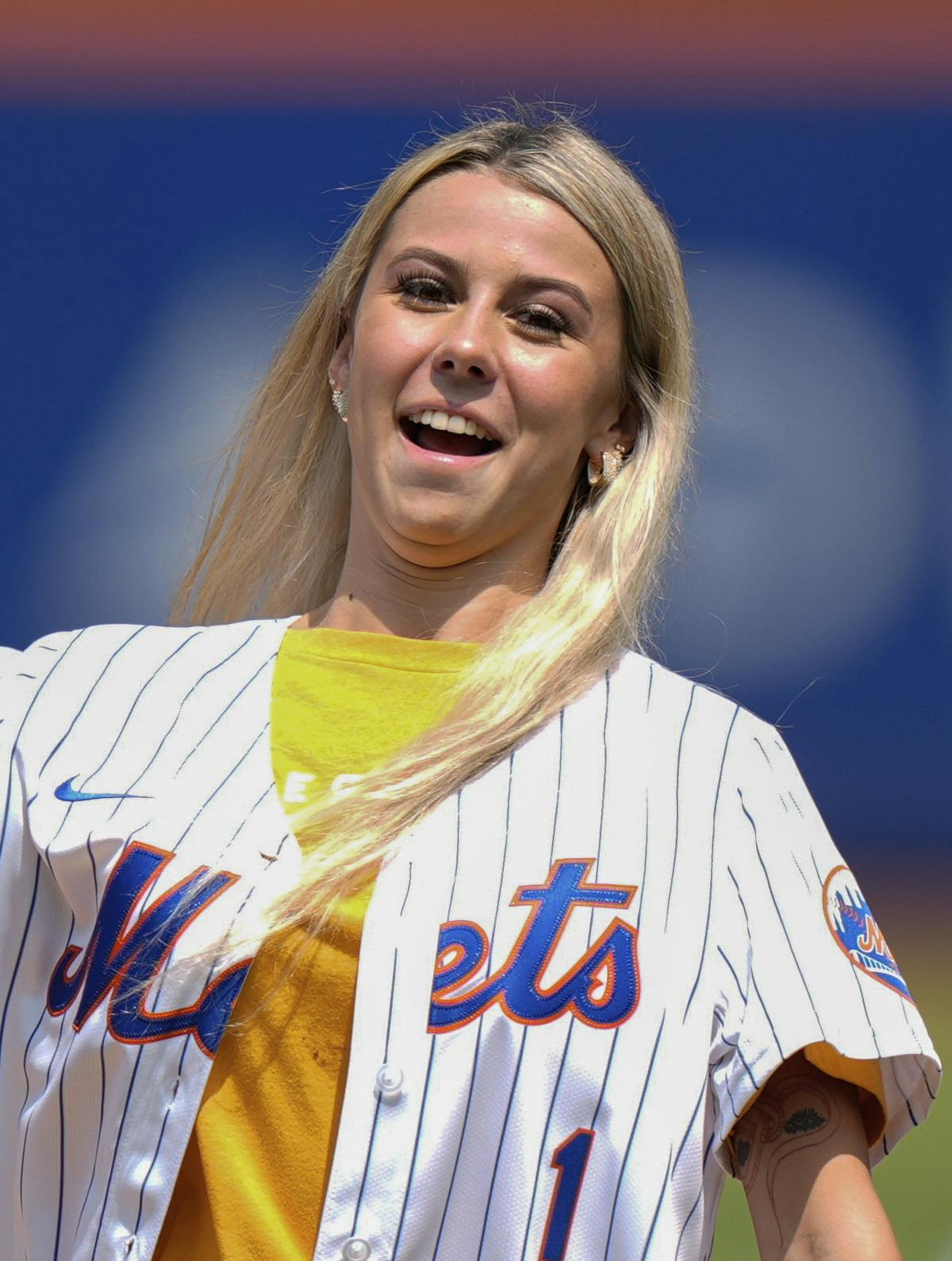 Hailey Welch throws out a ceremonial first pitch before a baseball game between the New York Mets and the Oakland Athletics, Thursday, Aug. 15, 2024, in New York. (AP Photo/Frank Franklin II)