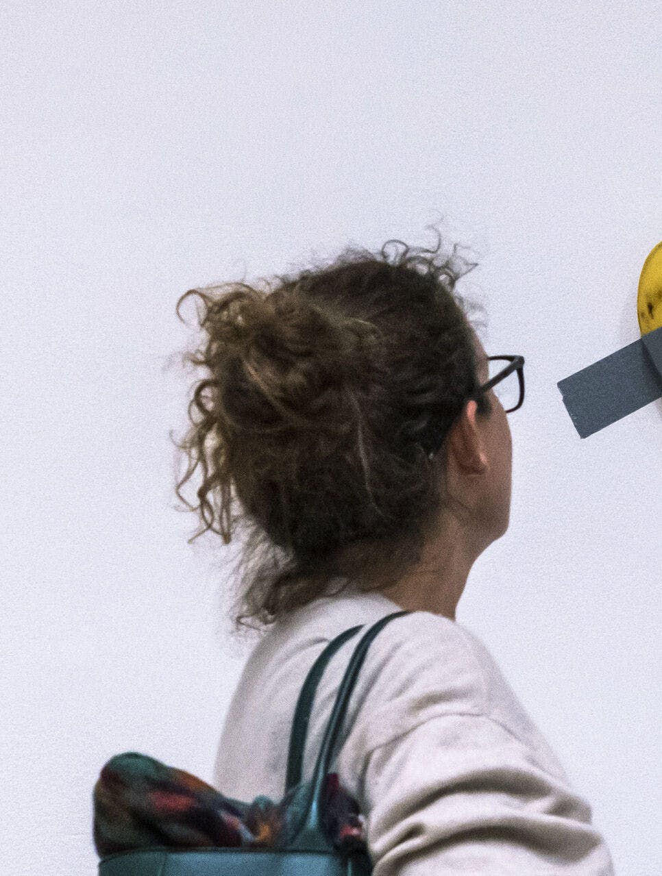 File - A woman looks at artist Maurizio Cattelan's piece of art "Comedian" during an auction preview at Sotheby's in New York, Monday, Nov. 11, 2024. (AP Photo/Eduardo Munoz Alvarez, File)