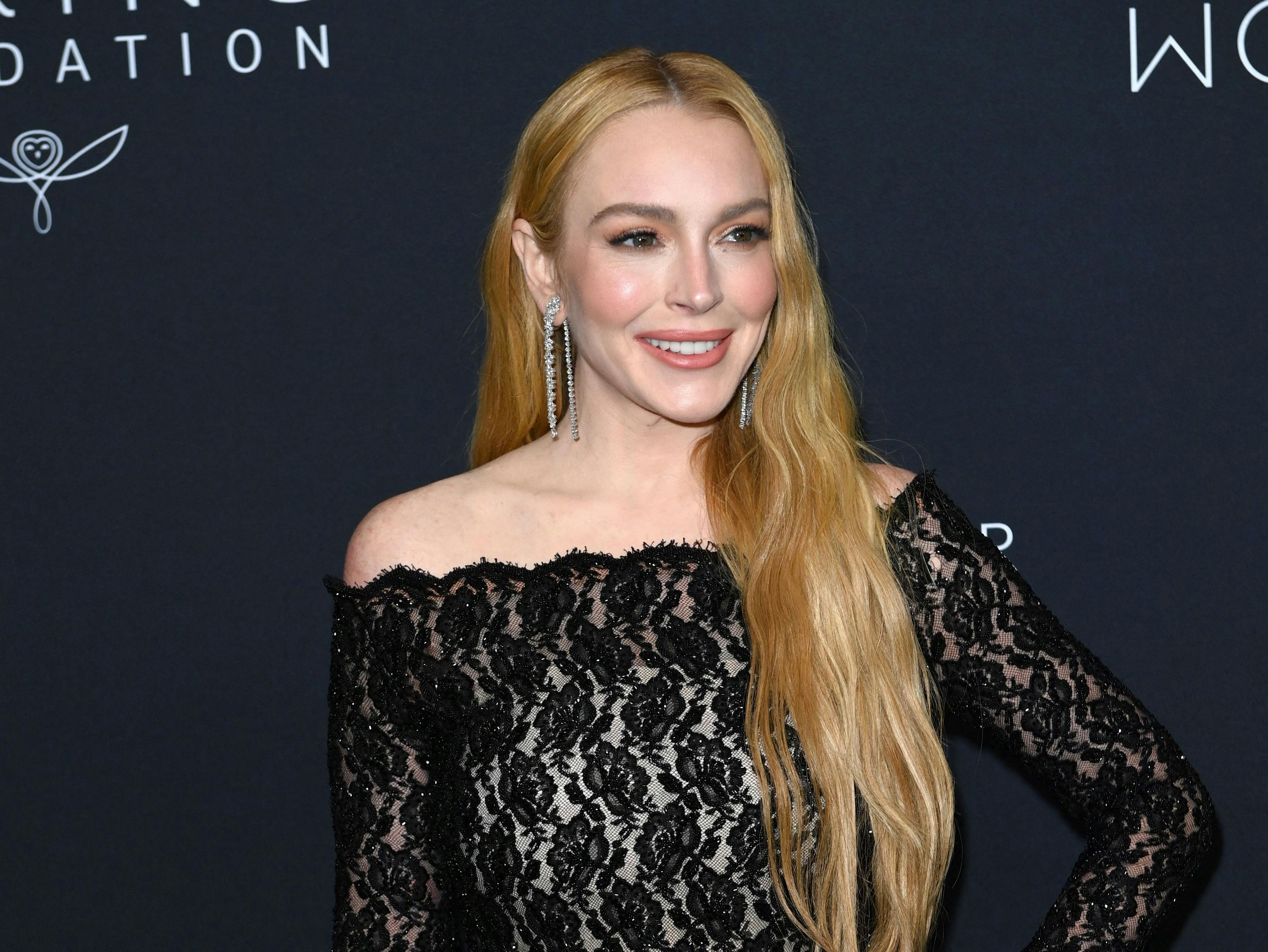 US actress Lindsay Lohan attends the 2024 Kering Foundation's Caring for Women dinner at The Pool in New York City on September 9, 2024. (Photo by Andrea RENAULT / AFP)