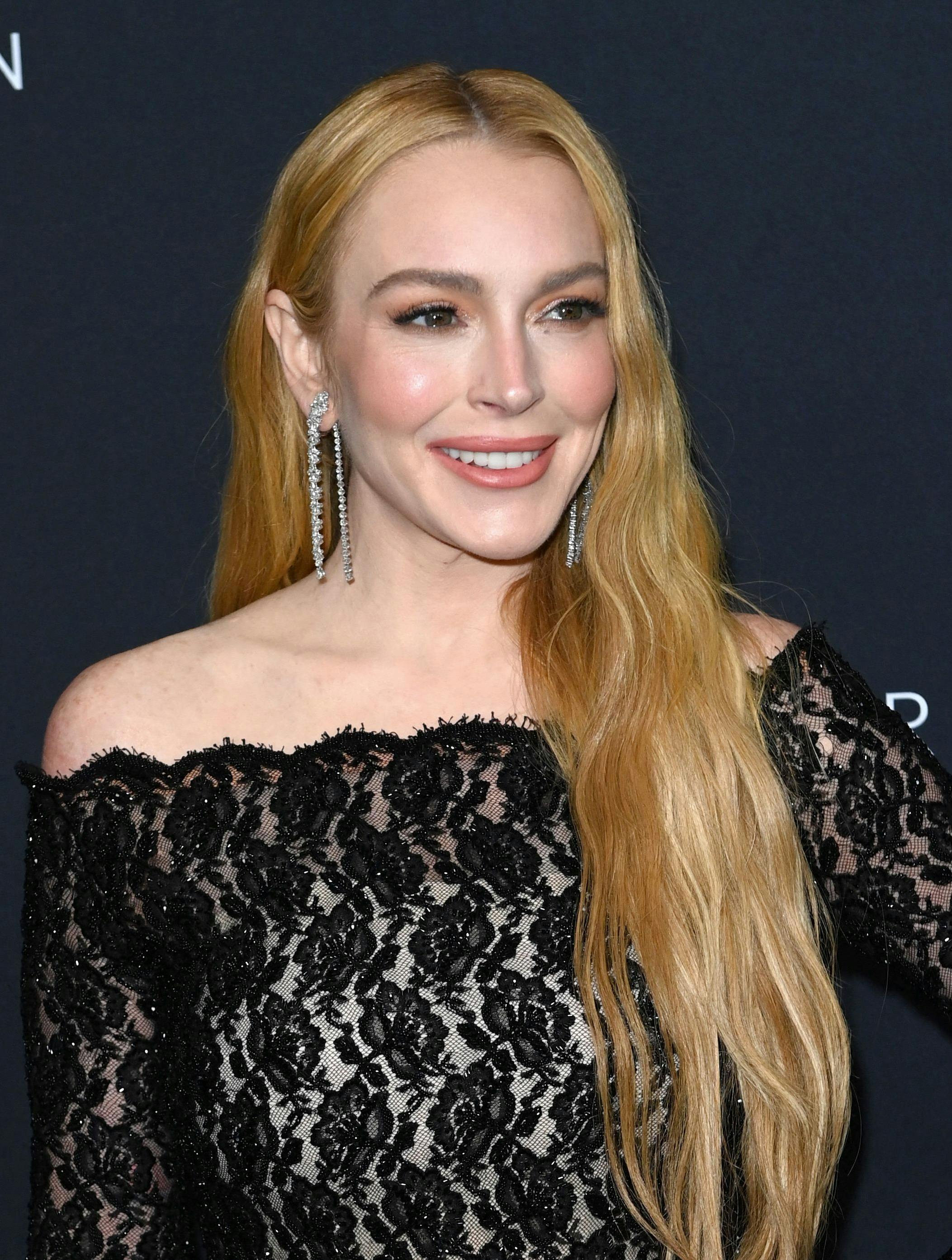 US actress Lindsay Lohan attends the 2024 Kering Foundation's Caring for Women dinner at The Pool in New York City on September 9, 2024. (Photo by Andrea RENAULT / AFP)