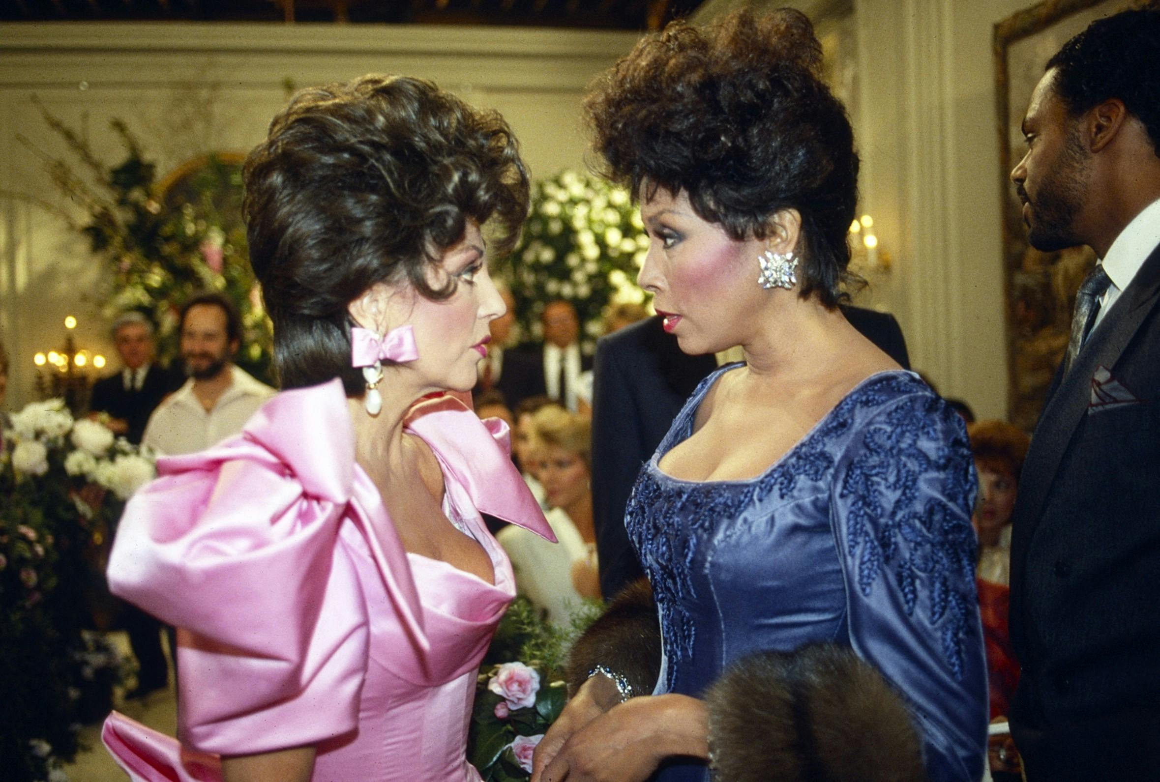 DYNASTY, from left: Joan Collins, Diahann Carroll, (1987), 1981-89. ph: Jim Globus/©ABC/Courtesy Everett Collection (Mega Agency TagID: MEGAET4DDYNAAB021_979345.jpg) [Photo via Mega Agency]