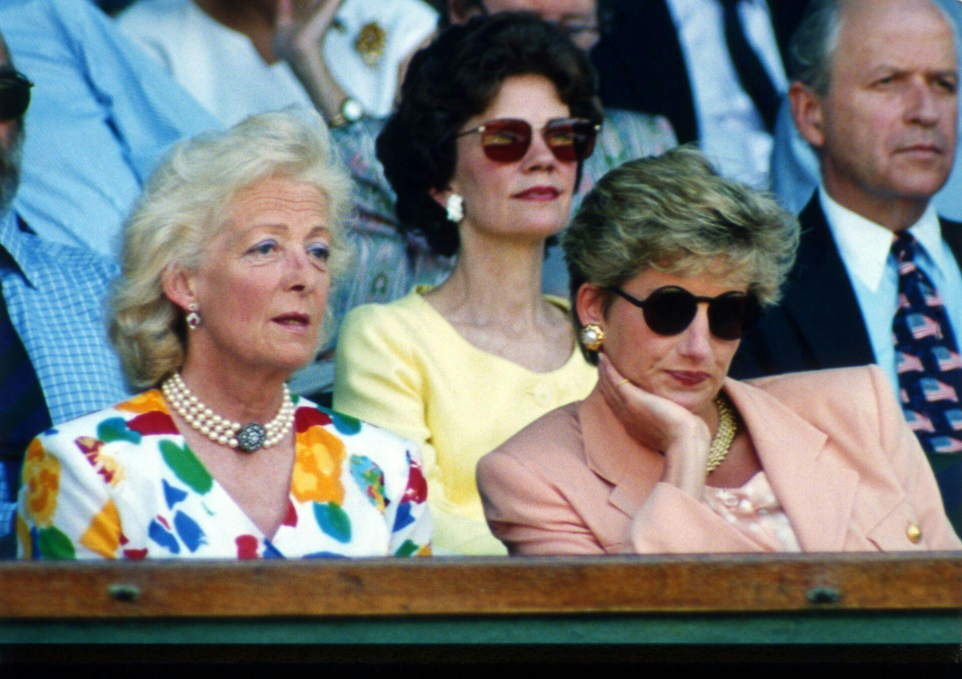 Princess Diana, the Princess of Wales, wearing sunglasses, sits beside her mother, Frances Shand Kydd, as they watch the Men's Singles Final between Pete Sampras and Jim Courier from the Royal Box on the Centre Court at Wimbledon, on July 4, 1993. (AP Photo/Denis Paquin)