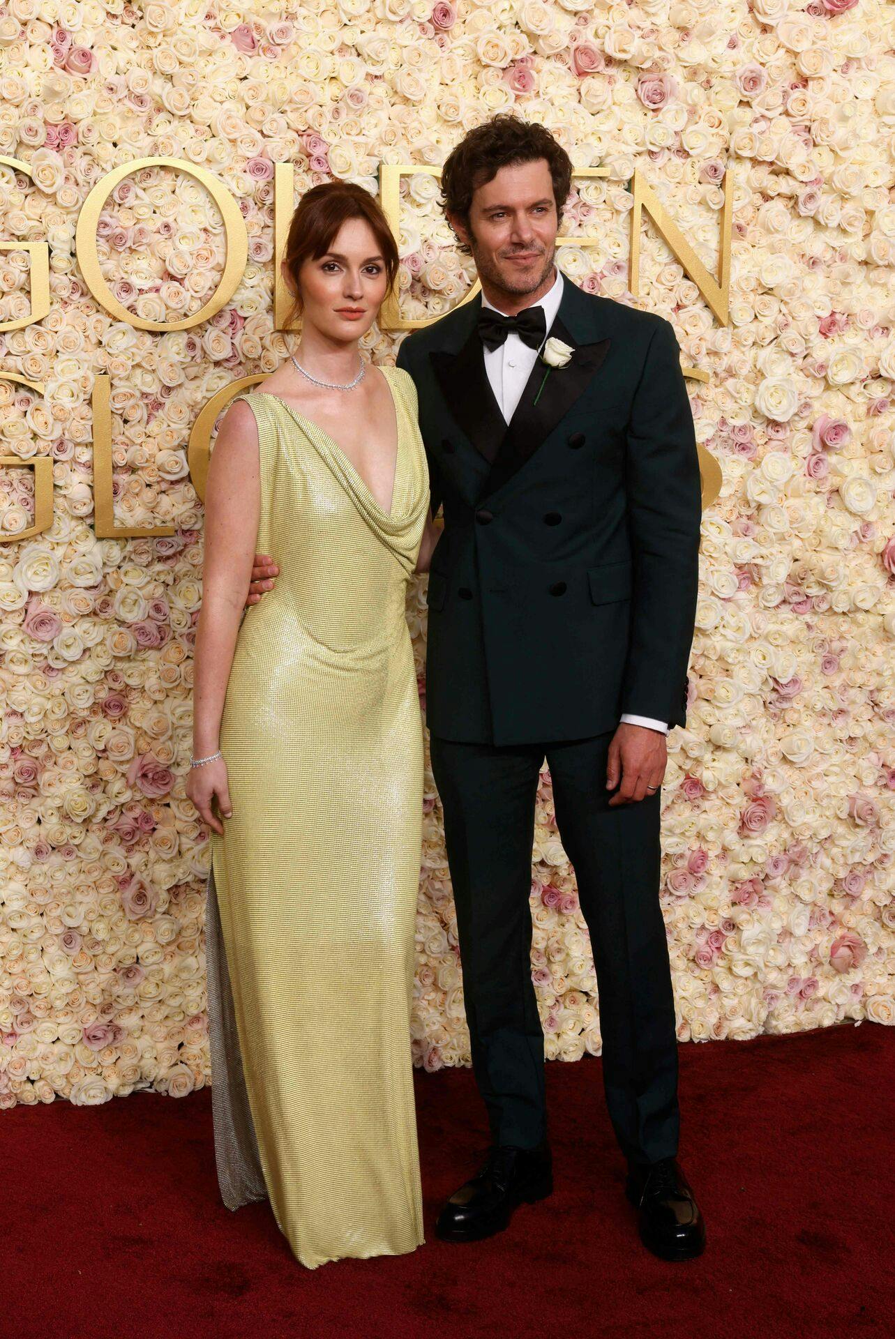 US actor Adam Brody (R) and US actress Leighton Meester arrive for the 82nd annual Golden Globe Awards at the Beverly Hilton hotel in Beverly Hills, California, on January 5, 2025. (Photo by Etienne LAURENT / AFP)