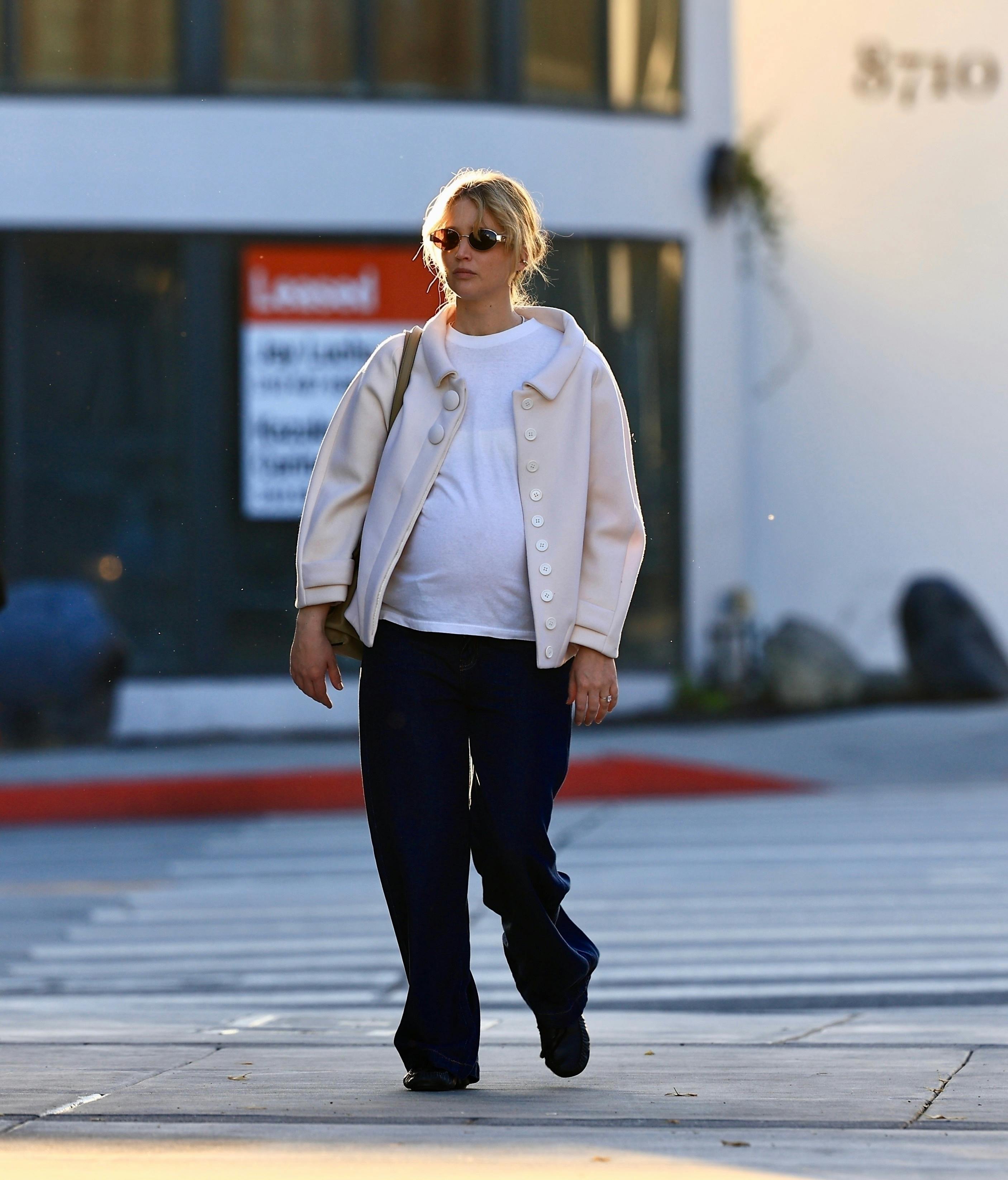 West Hollywood, CA - *EXCLUSIVE* - Actress Jennifer Lawrence was seen heading to Zinqué in West Hollywood with a friend, radiating elegance as she showcased her baby bump during the casual dinner outing. Pictured: Jennifer Lawrence BACKGRID USA 2 JANUARY 2025 BYLINE MUST READ: BACKGRID USA: +1 310 798 9111 / usasales@backgrid.com UK: +44 208 344 2007 / uksales@backgrid.com *UK Clients - Pictures Containing Children Please Pixelate Face Prior To Publication*