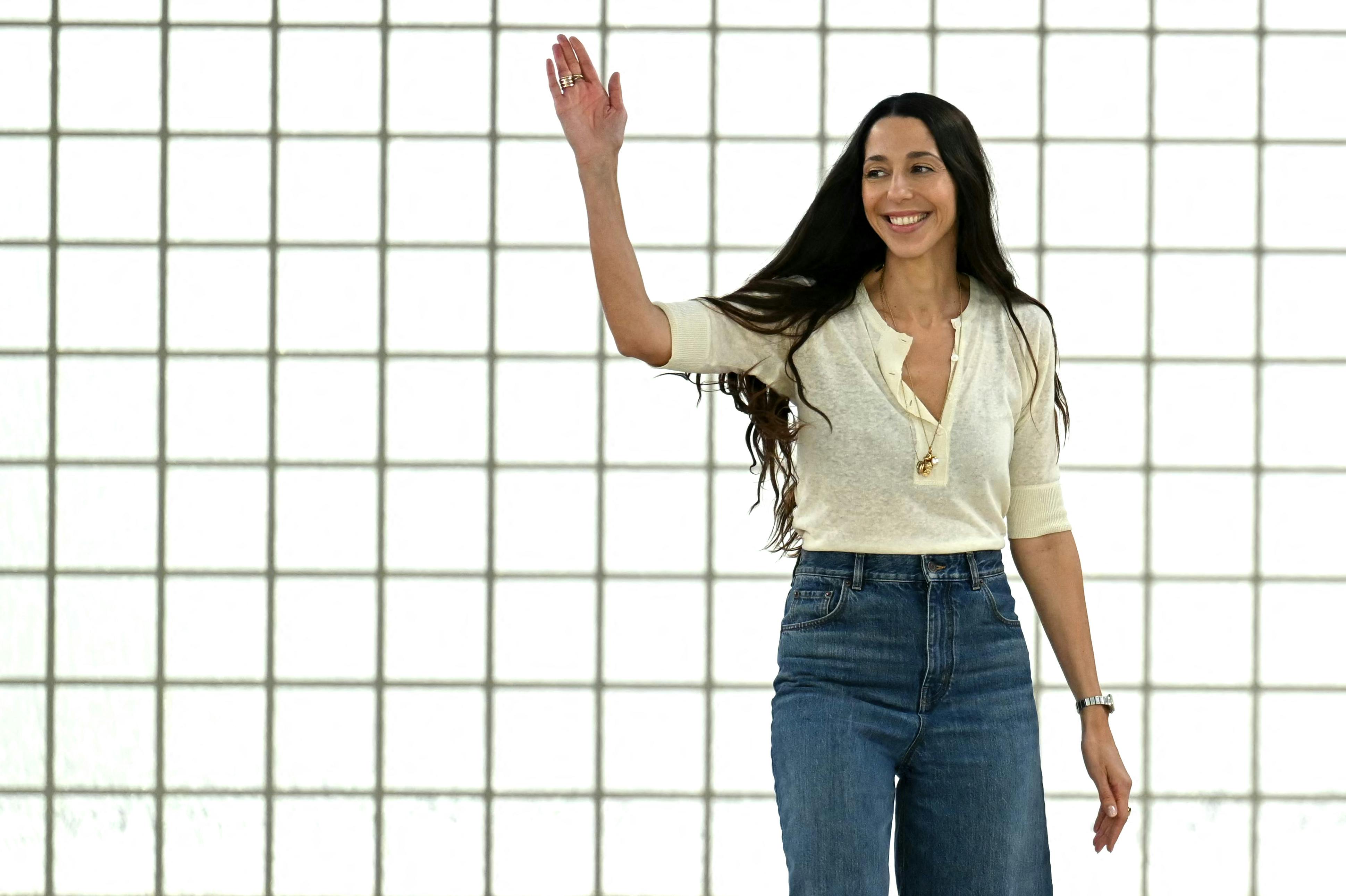 German fashion designer Chemena Kamali greets the audience following the presentation of her creations by Chloe for the Women Ready-to-wear Spring-Summer 2025 collection as part of the Paris Fashion Week, in Paris on September 26, 2024. Bertrand GUAY / AFP