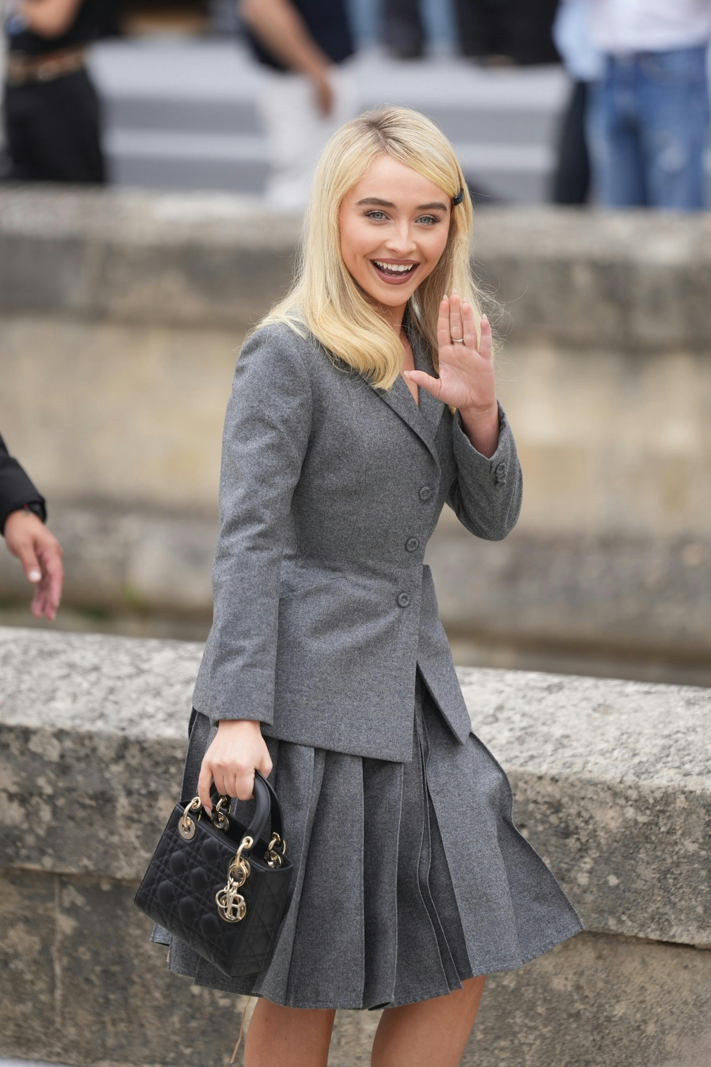 BGUK_3284394 - Paris, FRANCE Sabrina Carpenter makes a fashionable entrance at the Dior Fashion Show, wearing a sophisticated gray ensemble and carrying a sleek black Lady Dior mini bag. Pictured: Sabrina Carpenter BACKGRID UK 27 JUNE 2025 BYLINE MUST READ: DPTIG / BACKGRID UK: +44 208 344 2007 / uksales@backgrid.com USA: +1 310 798 9111 / usasales@backgrid.com *Pictures Containing Children Please Pixelate Face Prior To Publication*
