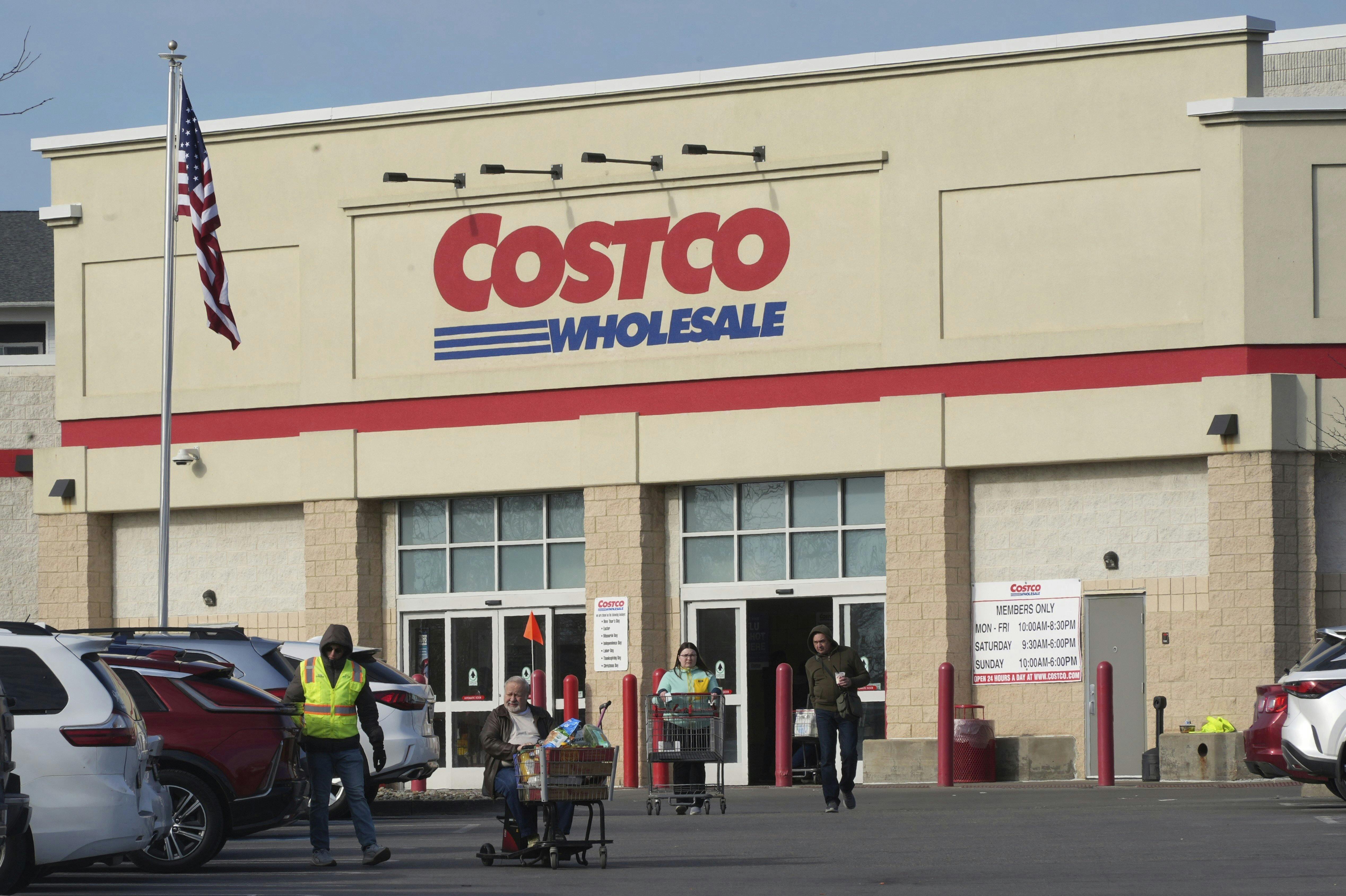 Shoppers head to their cars after shopping at this Costco Warehouse in Cranberry, Pa., Monday, March 3, 2025. (AP Photo/Gene J. Puskar)