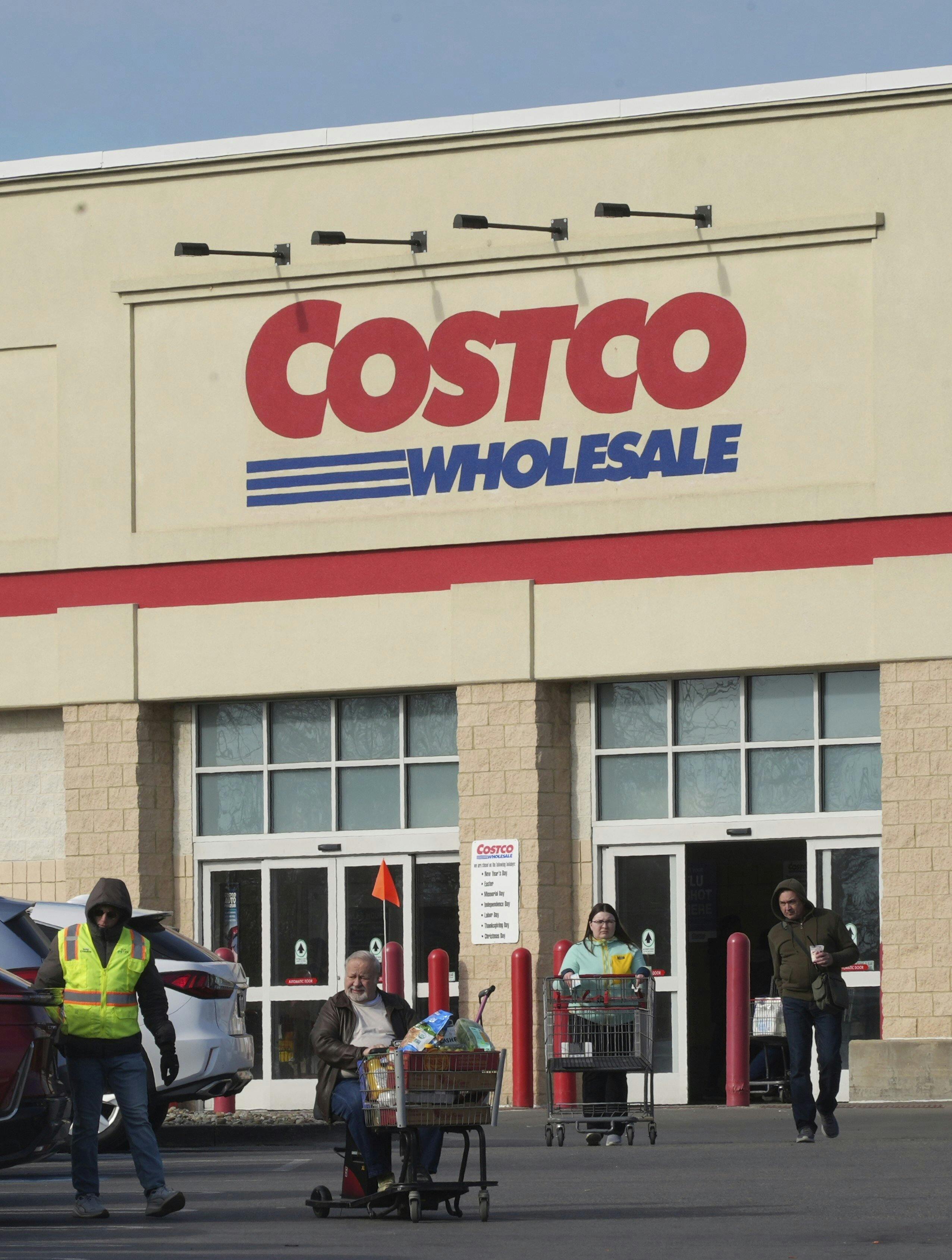 Shoppers head to their cars after shopping at this Costco Warehouse in Cranberry, Pa., Monday, March 3, 2025. (AP Photo/Gene J. Puskar)