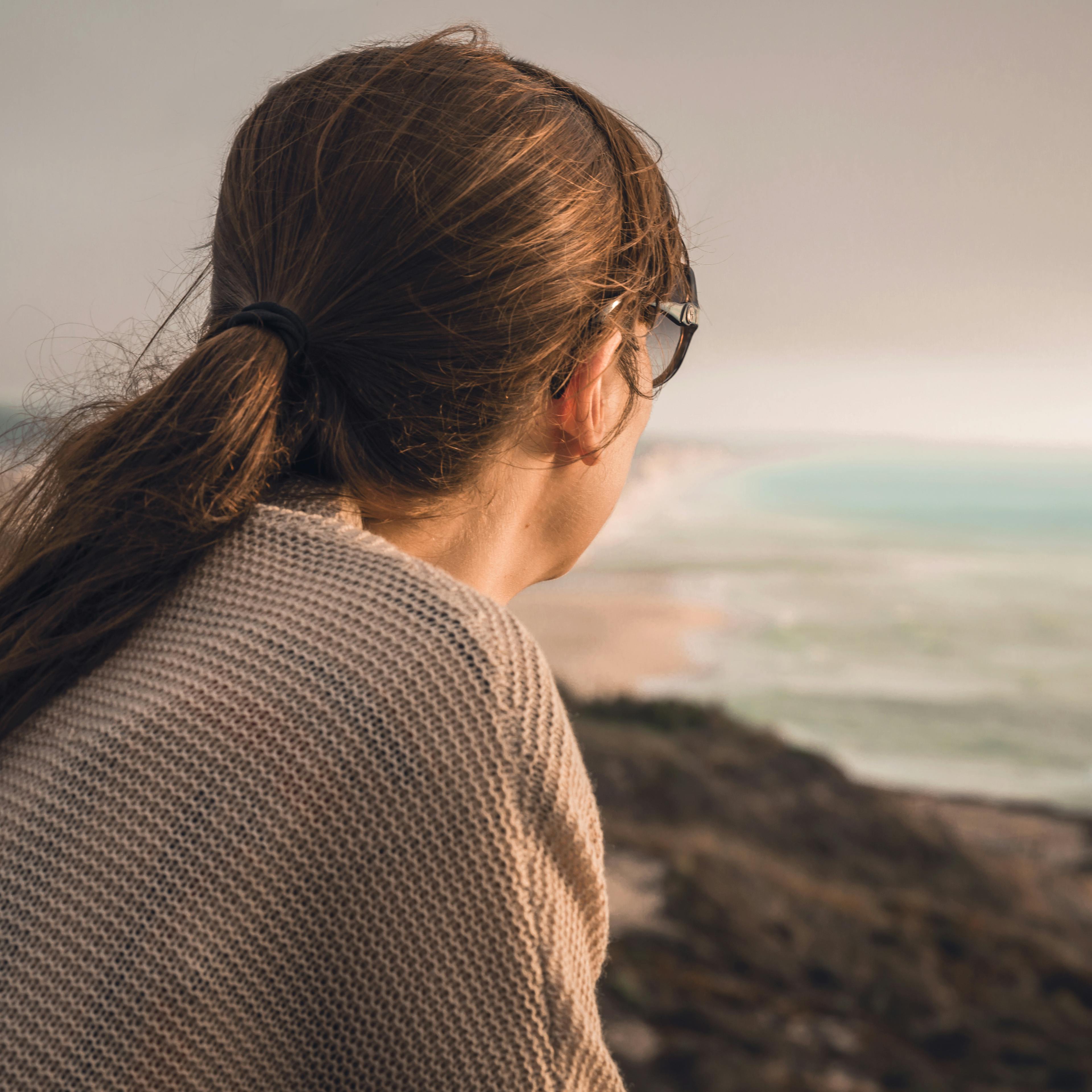 Woman alone lost in her thoughts