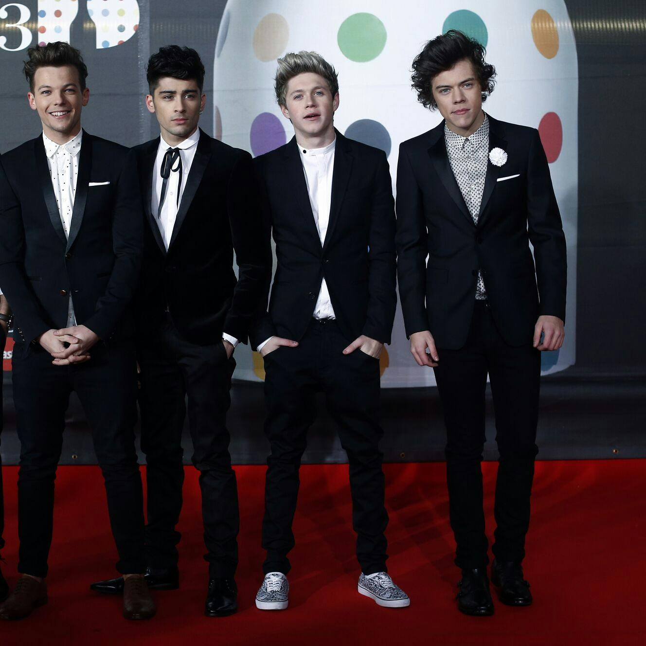 (FILES) In a file picture taken on February 20, 2013 (L-R) Liam Payne, Louis Tomlinson, Zayn Malik, Niall Horan and Harry Styles of British-Irish pop band 'One Direction' pose on the red carpet arriving at the BRIT Awards 2013 in London. Zayn Malik has left British boy band One Direction but it will continue without him, the group said March 25, 2015. AFP PHOTO / ANDREW COWIE