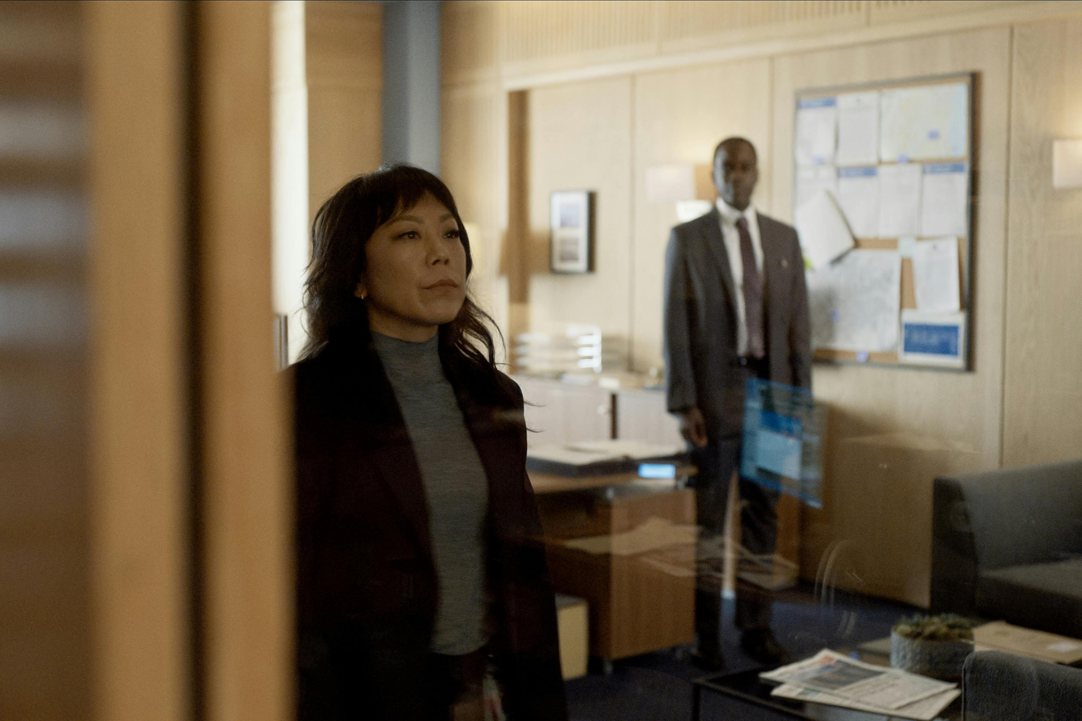 The Diplomat. (L to R) Ali Ahn as Eidra Park, Ato Essandoh as Stuart Hayford in episode 303 of The Diplomat. Cr. Courtesy of Netflix © 2025