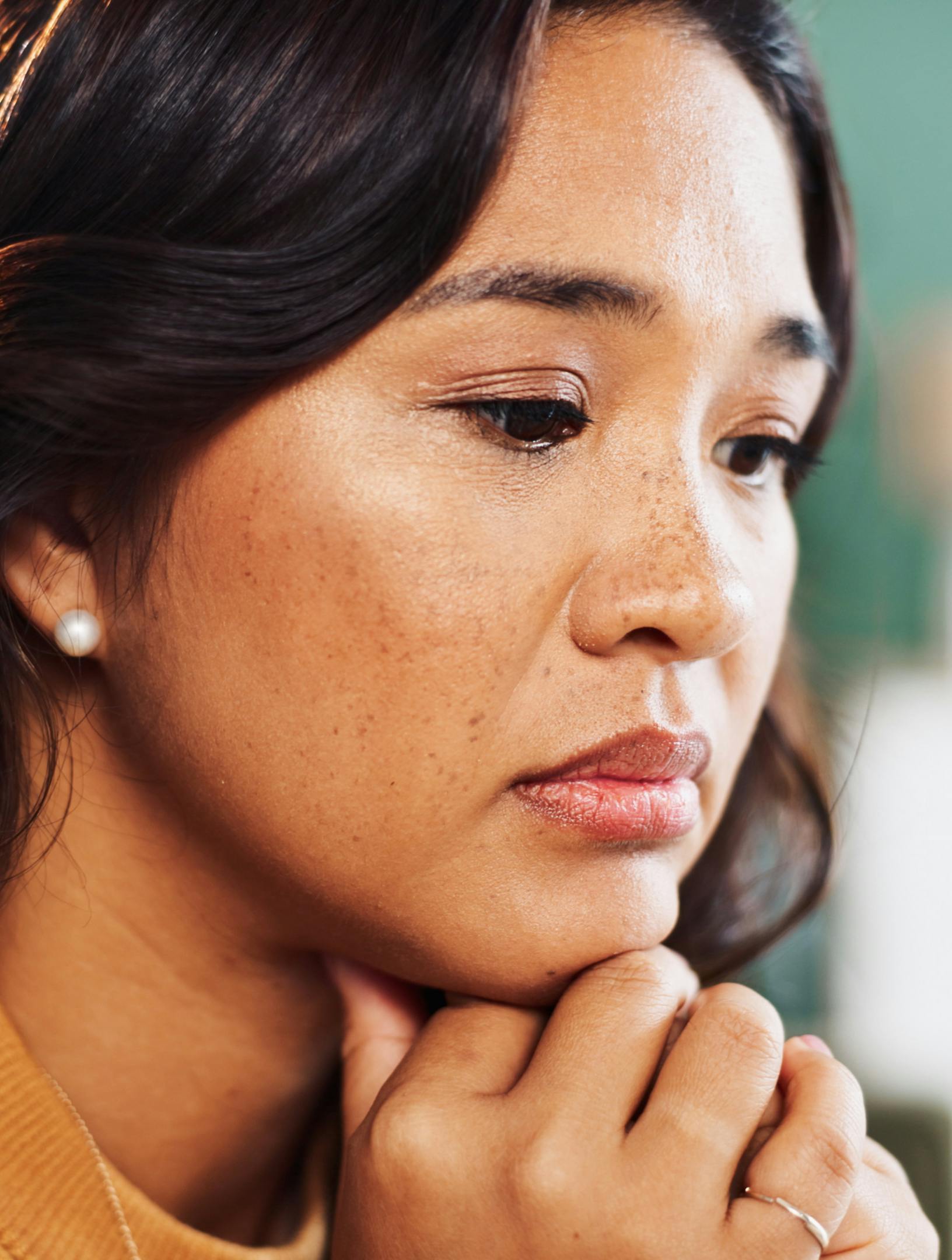 Thinking, anxiety or sad woman in house with worry, fear or abuse with stress, doubt and debt. Victim, lonely or scared person with depression with phobia, mistake or emotional crisis with trauma.