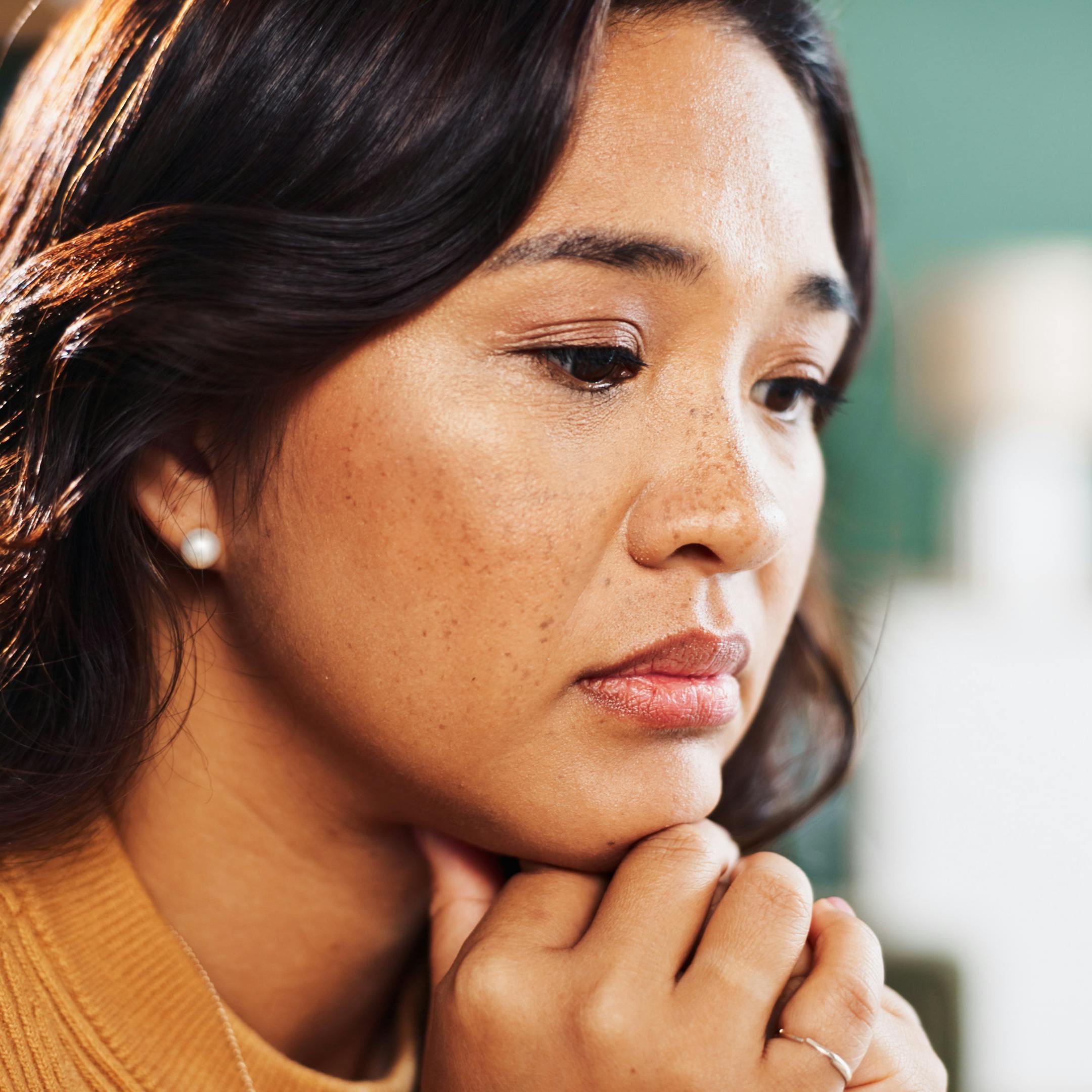 Thinking, anxiety or sad woman in house with worry, fear or abuse with stress, doubt and debt. Victim, lonely or scared person with depression with phobia, mistake or emotional crisis with trauma.