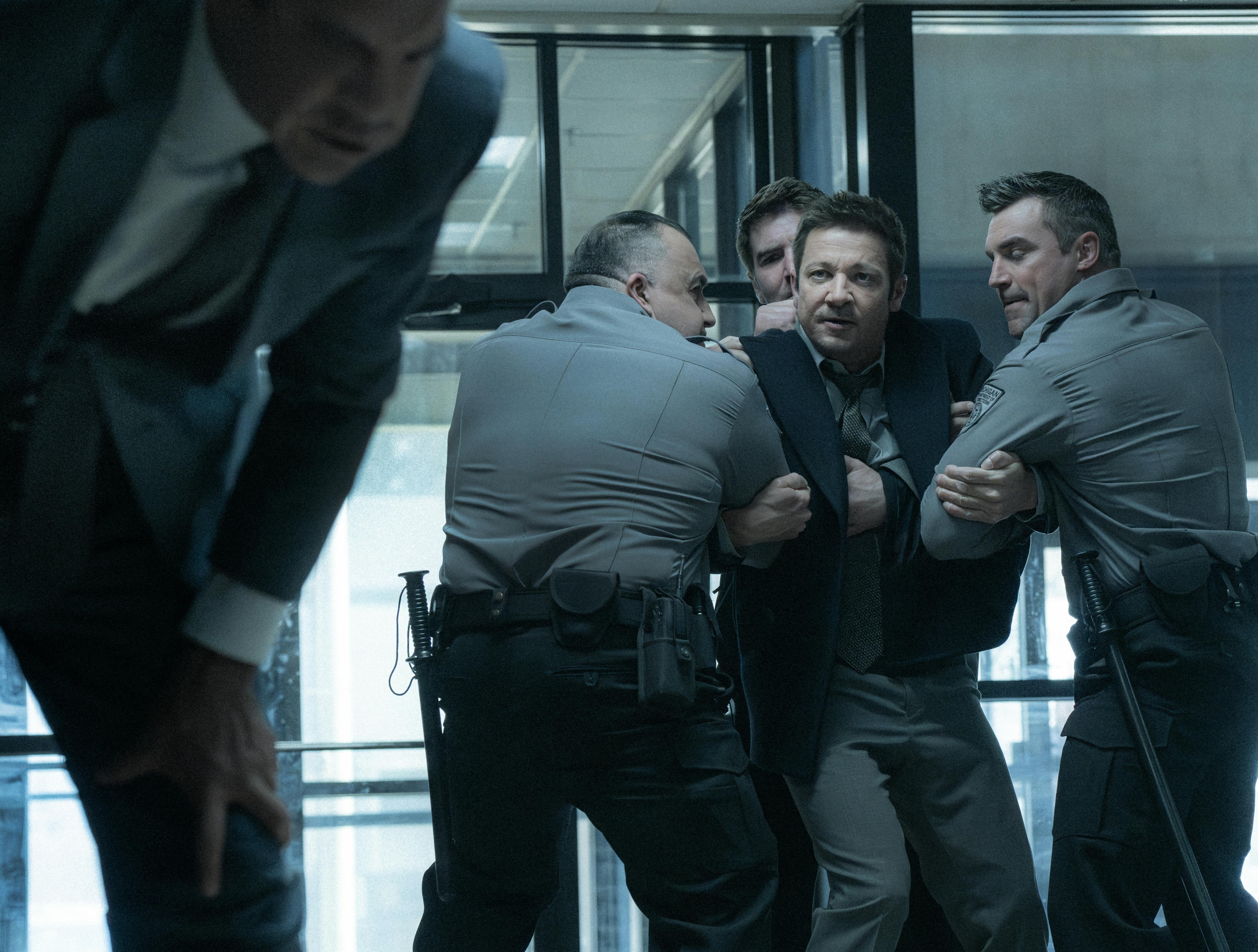 L-R: Clayton Cardenas as Torres and Jeremy Renner as Mike McLusky in Mayor of Kingstown season 4, streaming on Paramount+, 2025. Credit: Dennis P. Mong Jr./Paramount+ ©2025 Viacom International Inc. All Rights Reserved. Mayor of Kingstown and all related titles, logos and characters are trademarks of Viacom International Inc.