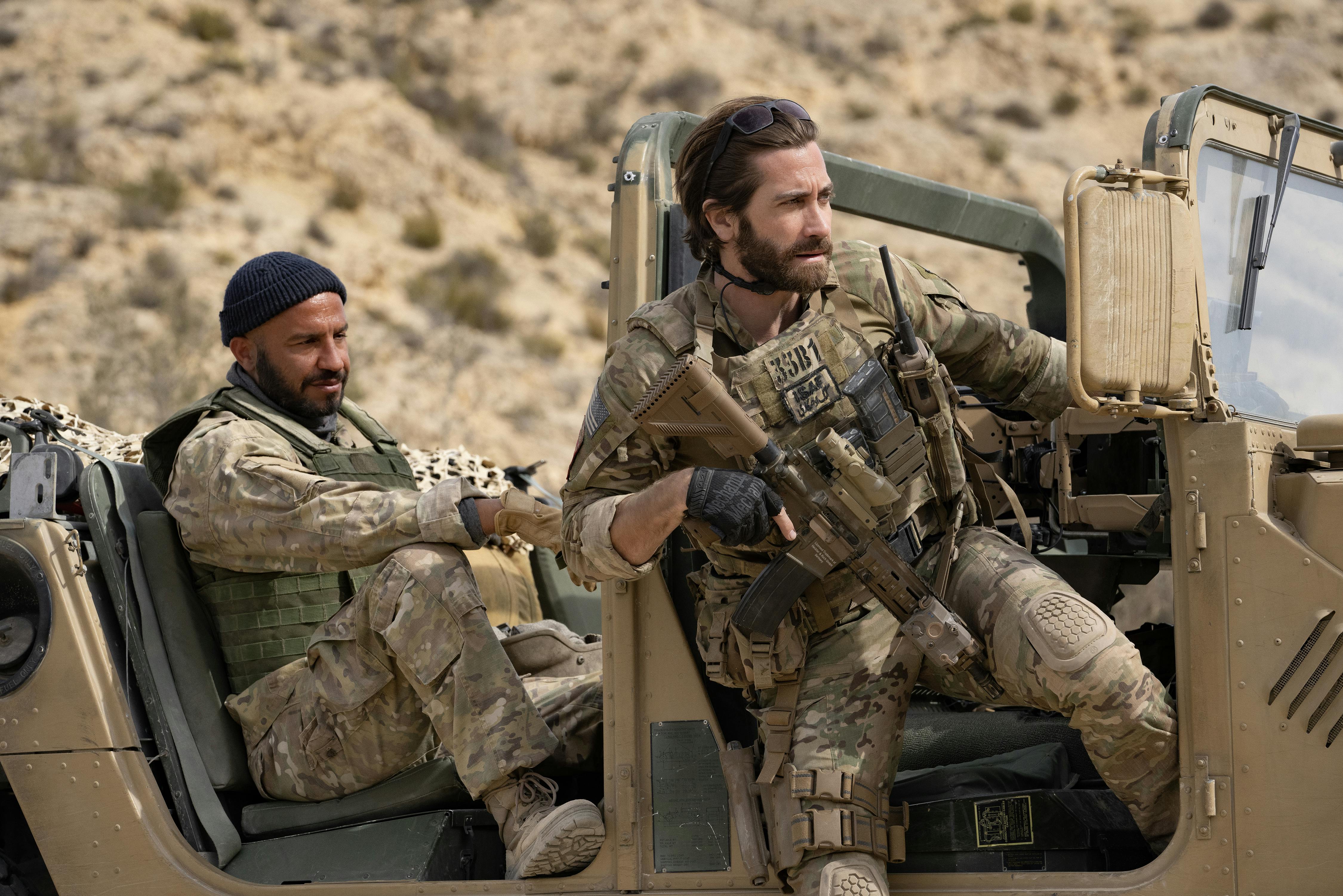 Dar Salim (left) as Ahmed and Jake Gyllenhaal (right) as Sgt. John Kinley in THE COVENANT, directed by Guy Ritchie, a Metro Goldwyn Mayer Pictures film. Credit: Christopher Raphael / Metro Goldwyn Mayer Pictures© 2023 Metro-Goldwyn-Mayer Pictures Inc.  All Rights Reserved.
