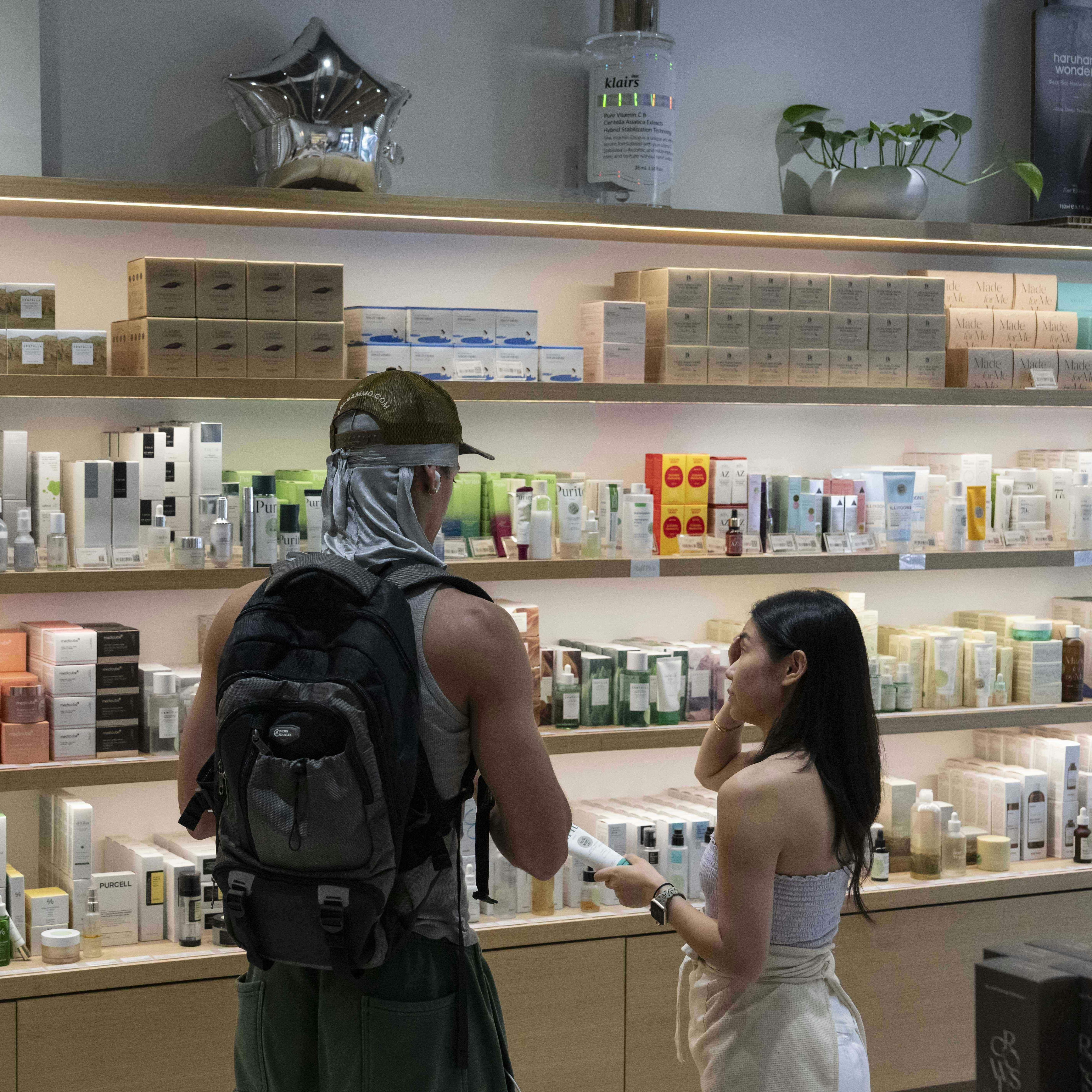 A customer checks Asian beauty products at a Senti Senti store in New York on Friday, July 25, 2025. (AP Photo/Yuki Iwamura)
