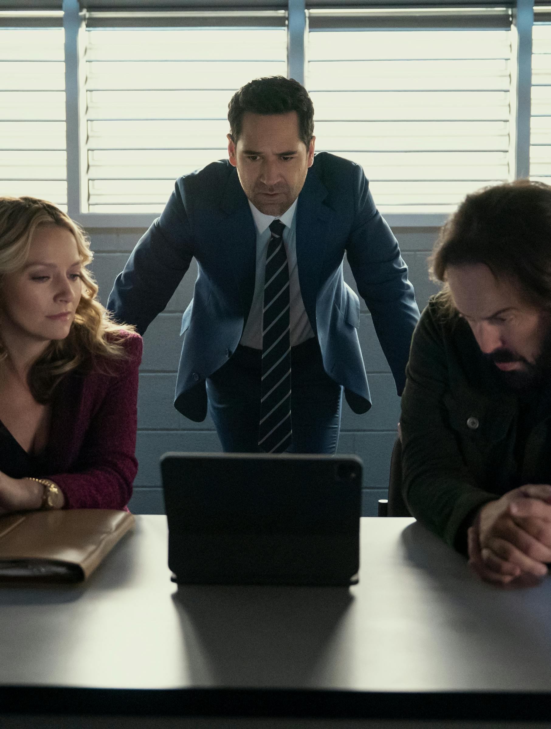 The Lincoln Lawyer. (L to R) Becki Newton as Lorna Crane, Manuel Garcia-Rulfo as Mickey Haller, Angus Sampson as Denis "Cisco" Wojciechowski in episode 402 of The Lincoln Lawyer. Cr. Kim Alexis/Netflix © 2026